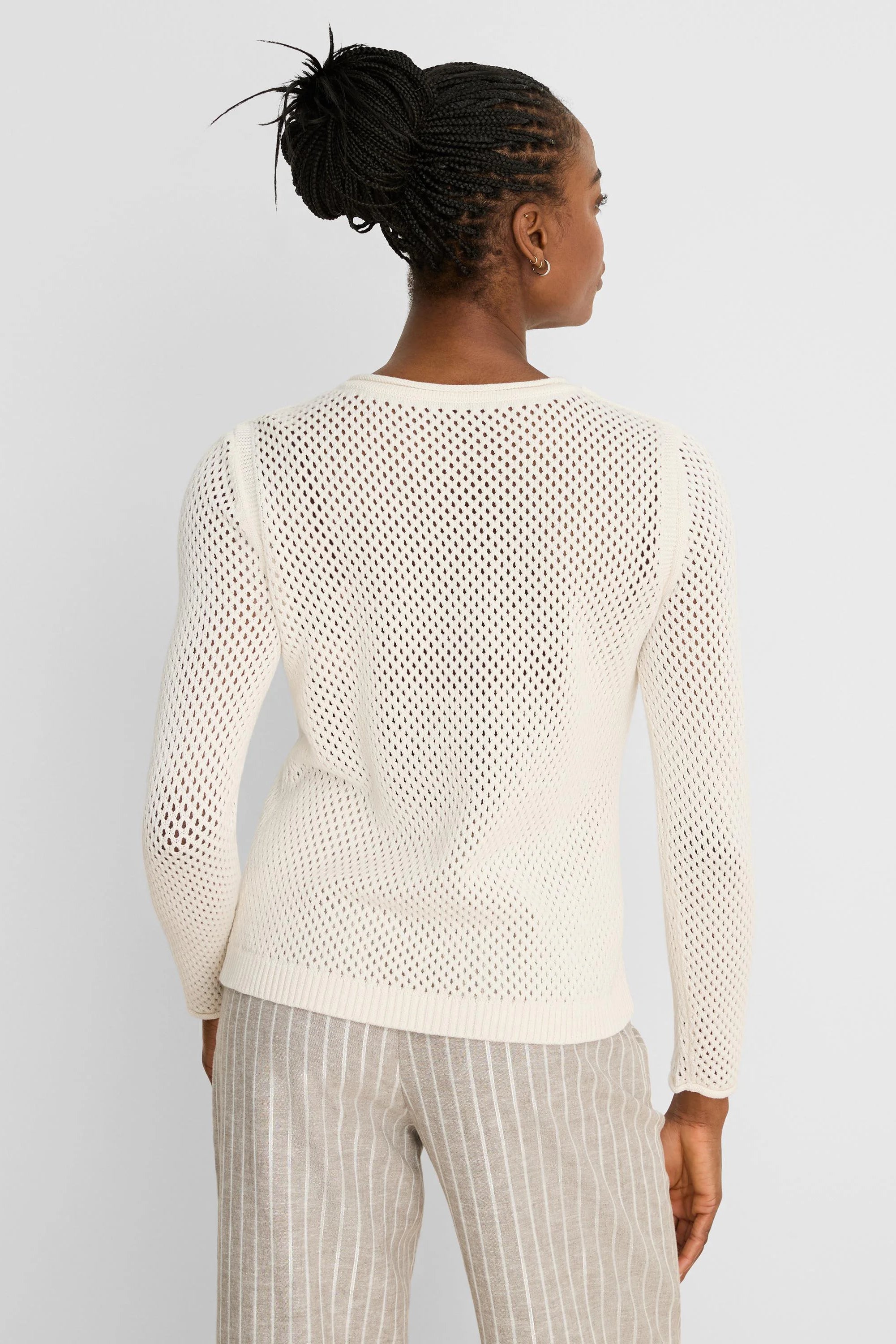 Cream long-sleeved sweater with an open mesh knit and crew neck, shown from the back.