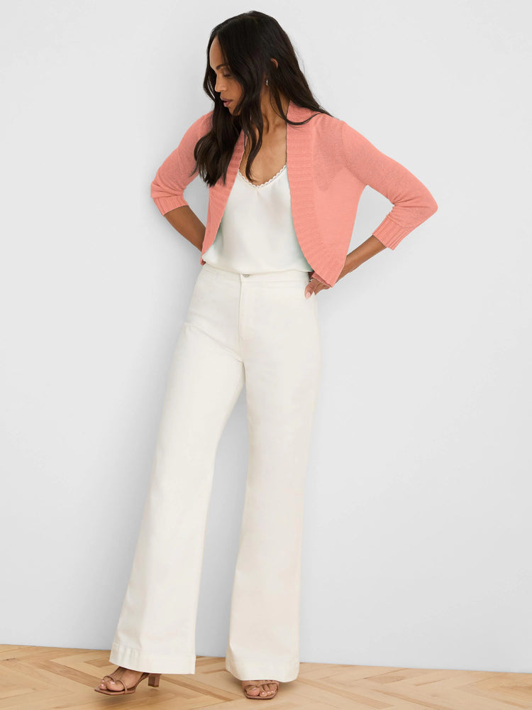 Peach bolero cardigan with open front and 3/4 sleeves.