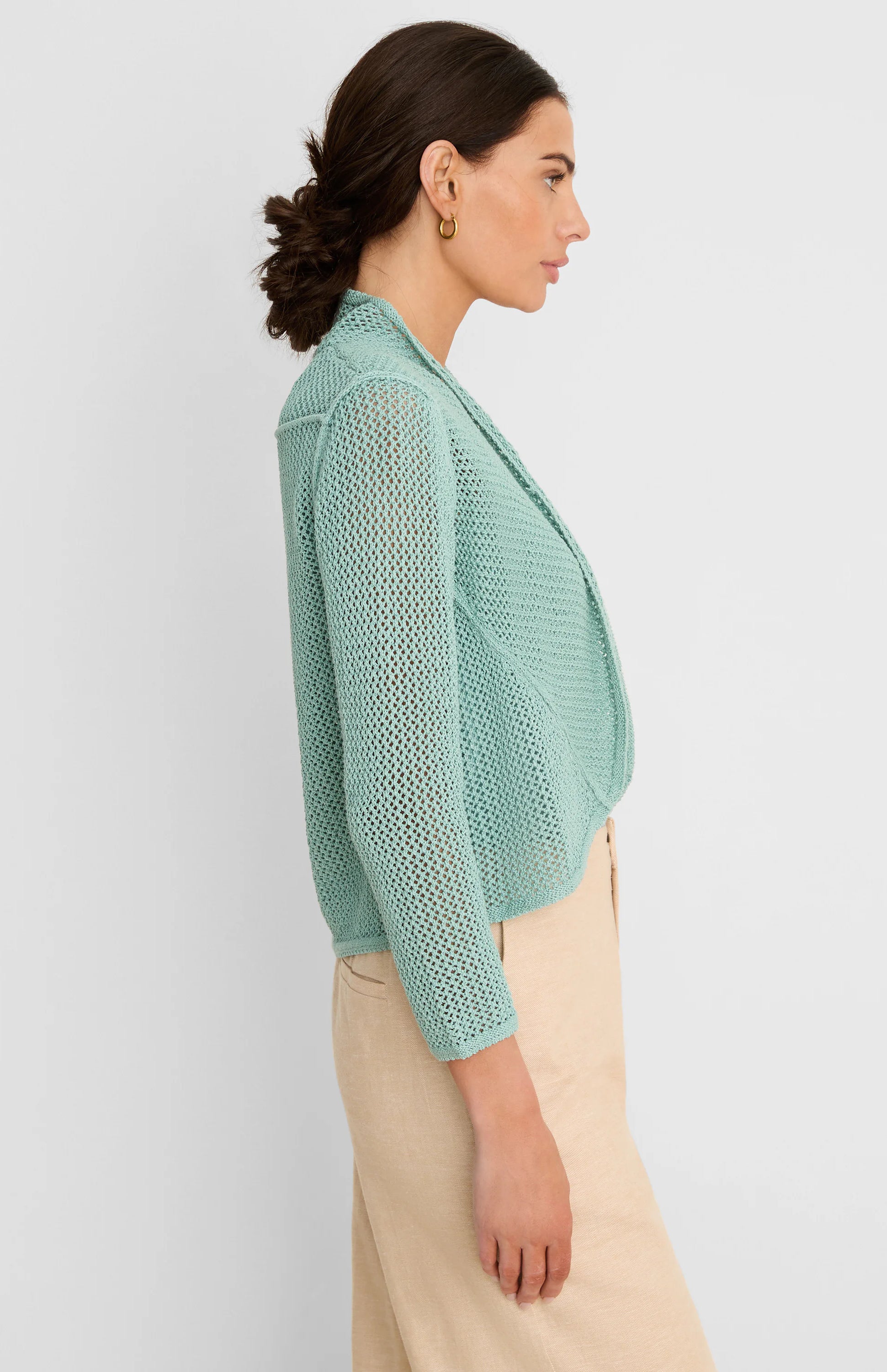 Mint green open-knit mesh cocoon cardigan, draped and cropped.
