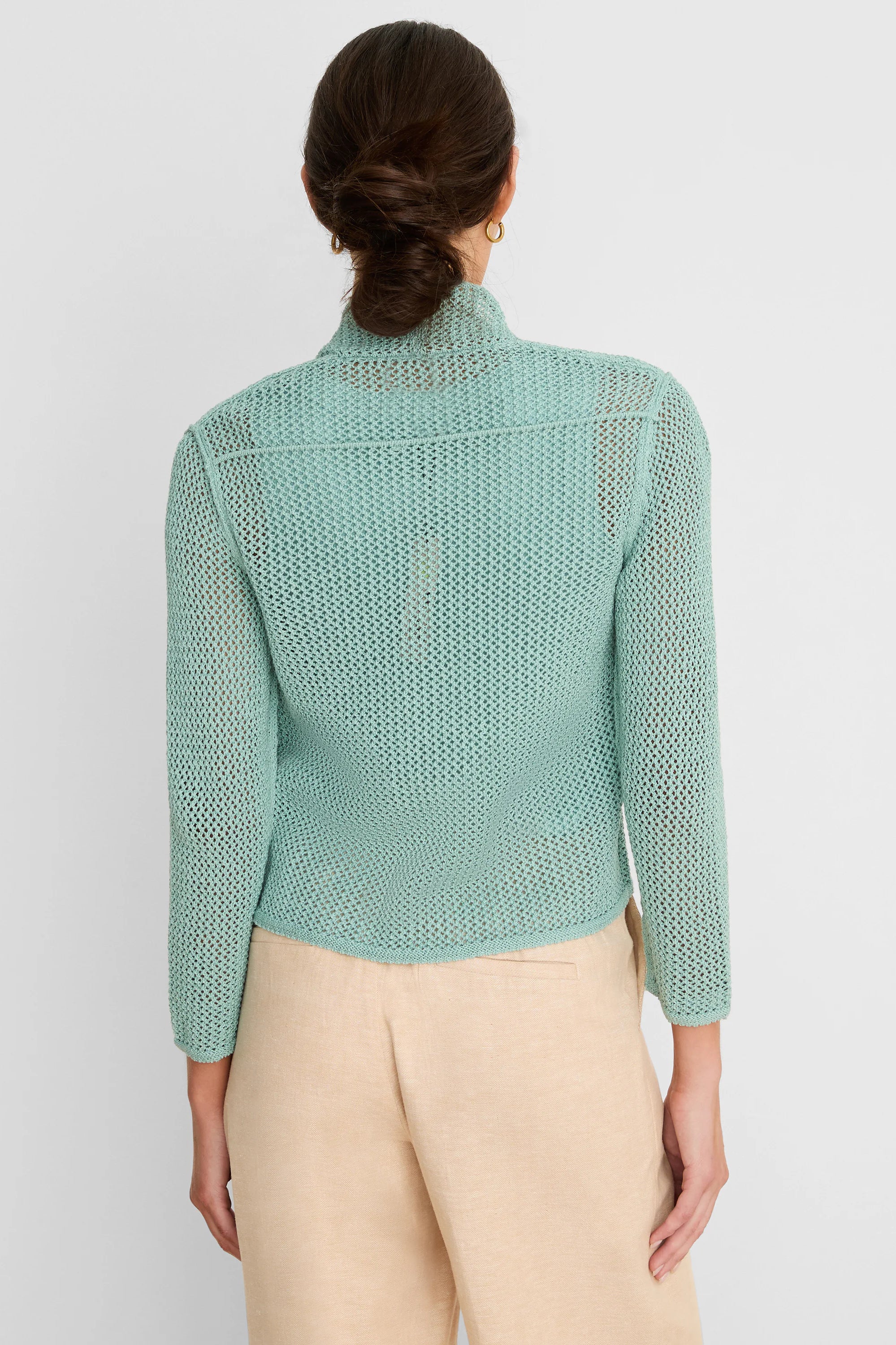 Mint green open-knit mesh cardigan with a relaxed cocoon fit, shown from the back.