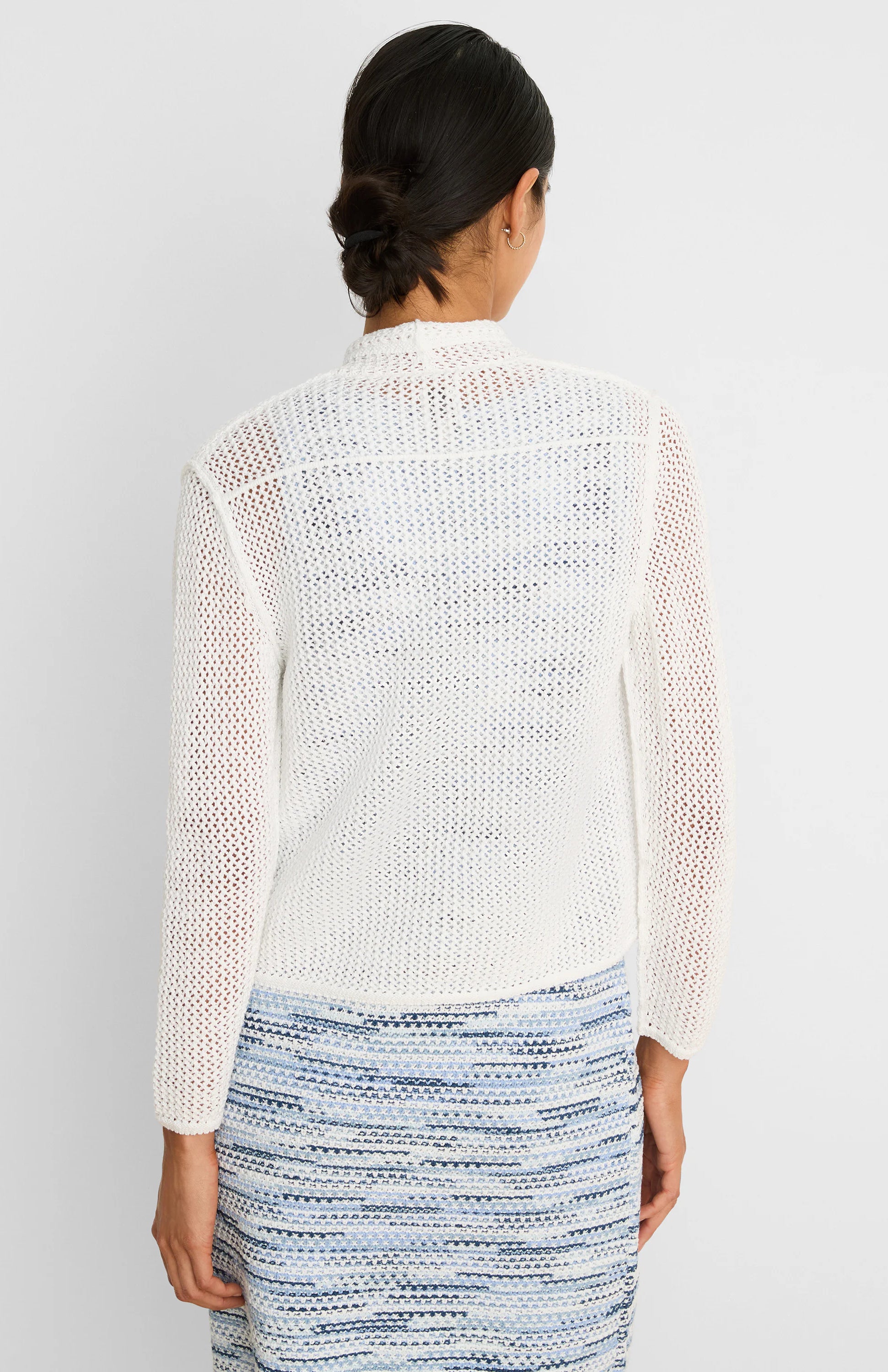 White mesh cocoon cardigan, back view. Loose, open knit with long sleeves.