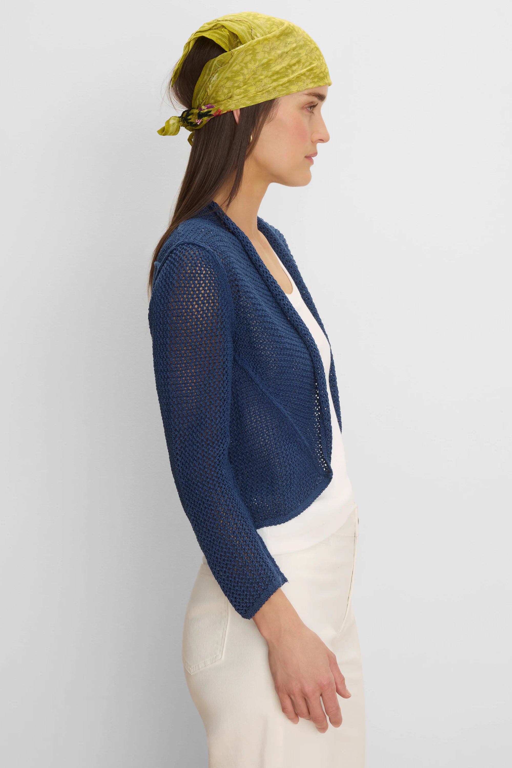 Deep blue open-knit mesh cocoon cardigan, short and open-front style.