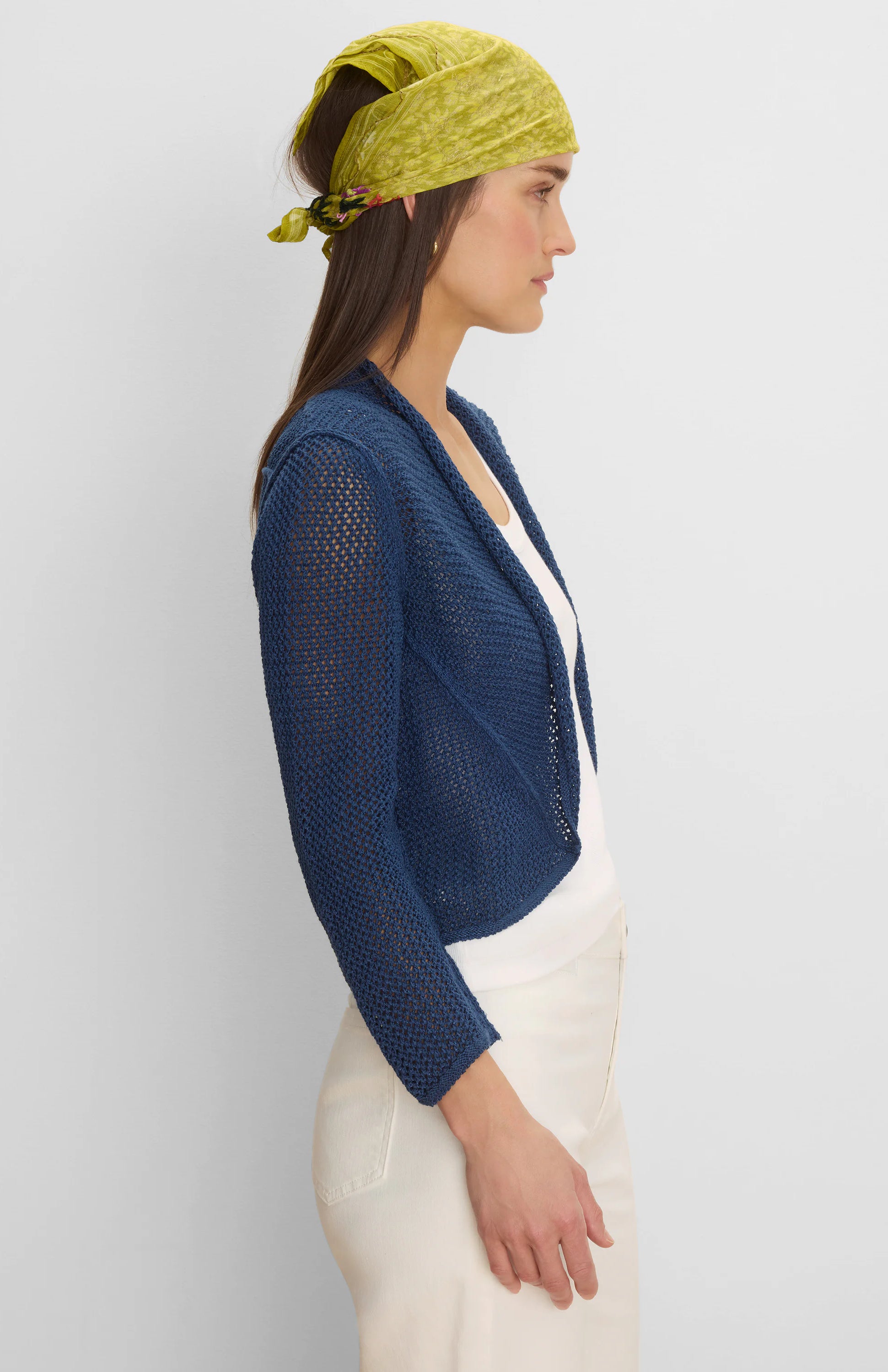 Deep blue open-knit mesh cocoon cardigan, short and open-front style.