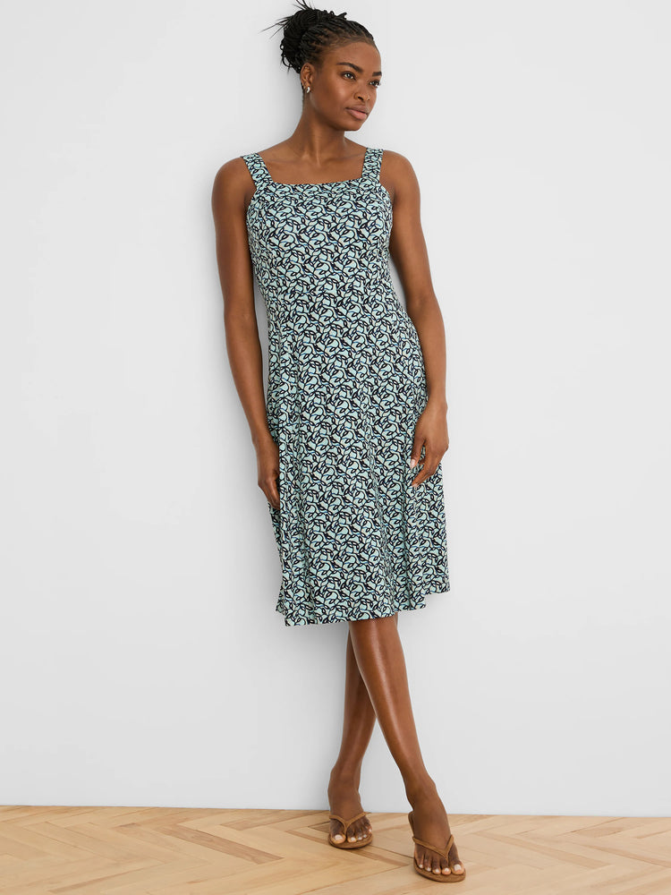 Sleeveless square-neck dress with an aqua and dark blue interlocking leaf pattern, midi length.