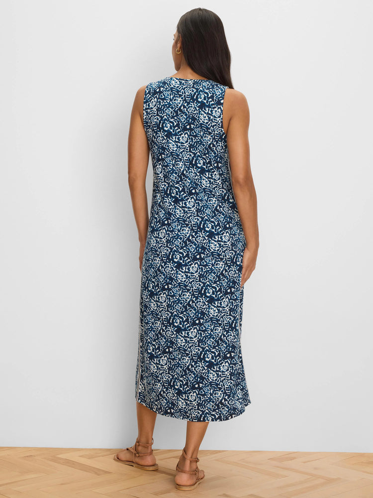 Dark blue & white shibori-patterned sleeveless dress, midi length, seen from back on a model.