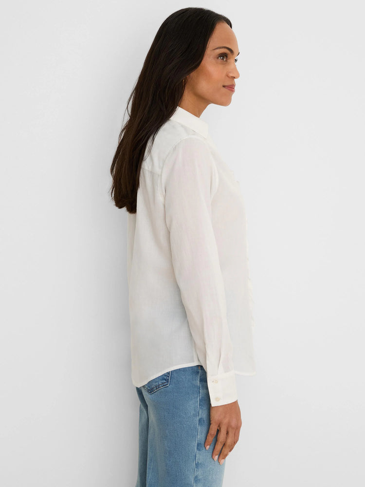 White long-sleeved cotton shirt with subtle ruffles along the button front.