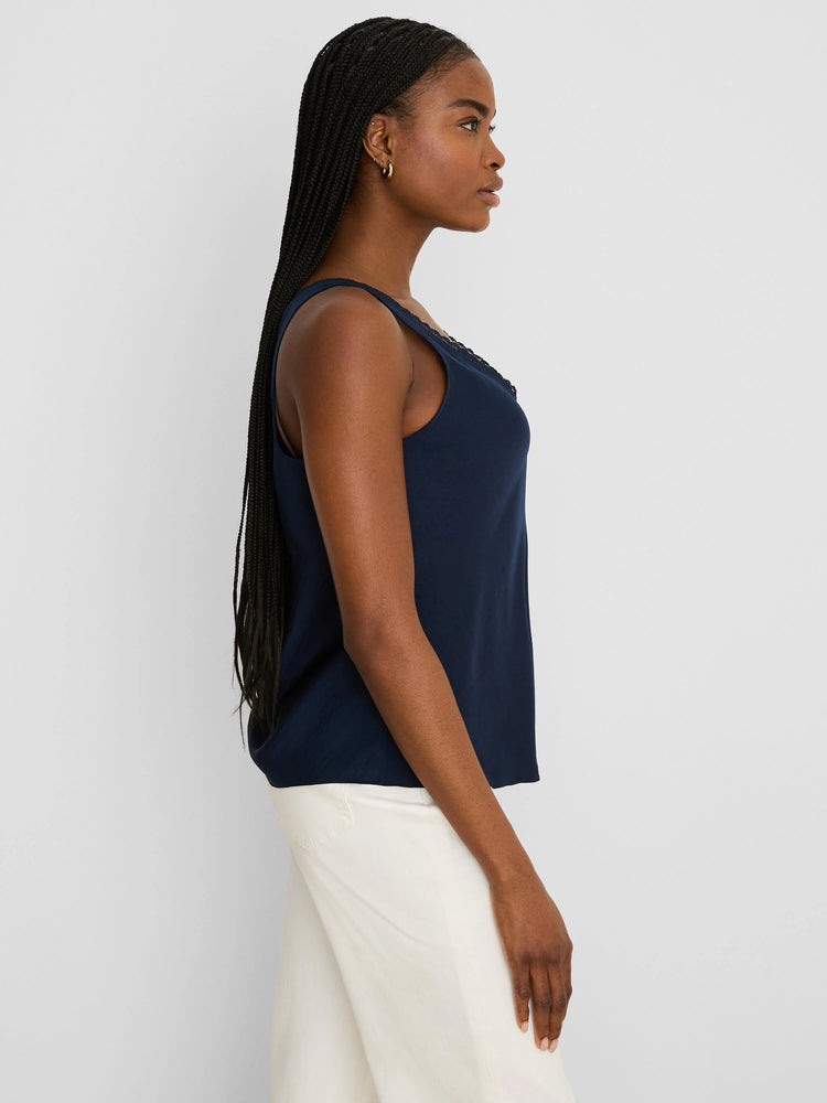 Navy blue sleeveless tank top with black lace trim along the scoop neckline.
