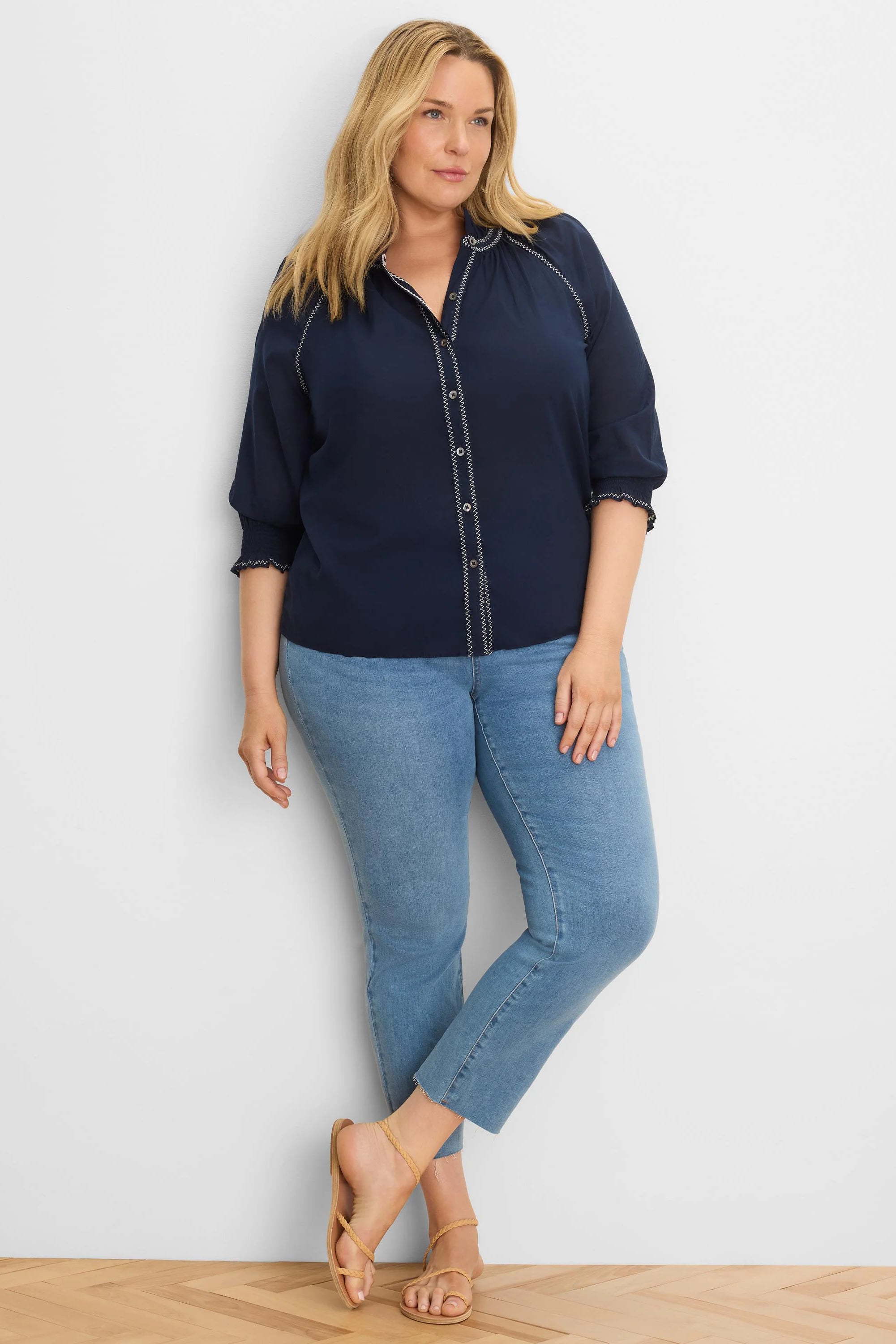 Navy cotton crinkle shirt with white zig-zag stitching on placket, collar, and 3/4 sleeves.