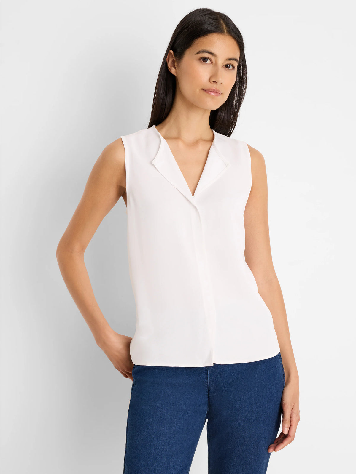 Off-white sleeveless top with V-neck and folded revere collar, smooth texture.