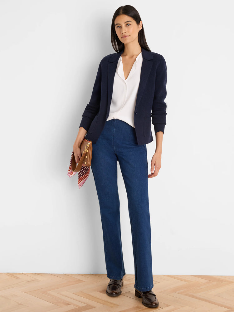 Navy blue knit layering top with blazer-style lapels, single button closure, and two front patch pockets.