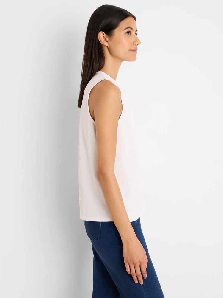 Light cream sleeveless top with a round neck.