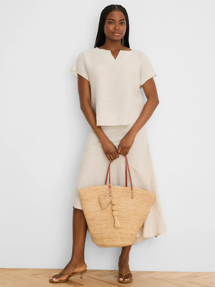Natural linen split neck tee with short, relaxed sleeves.