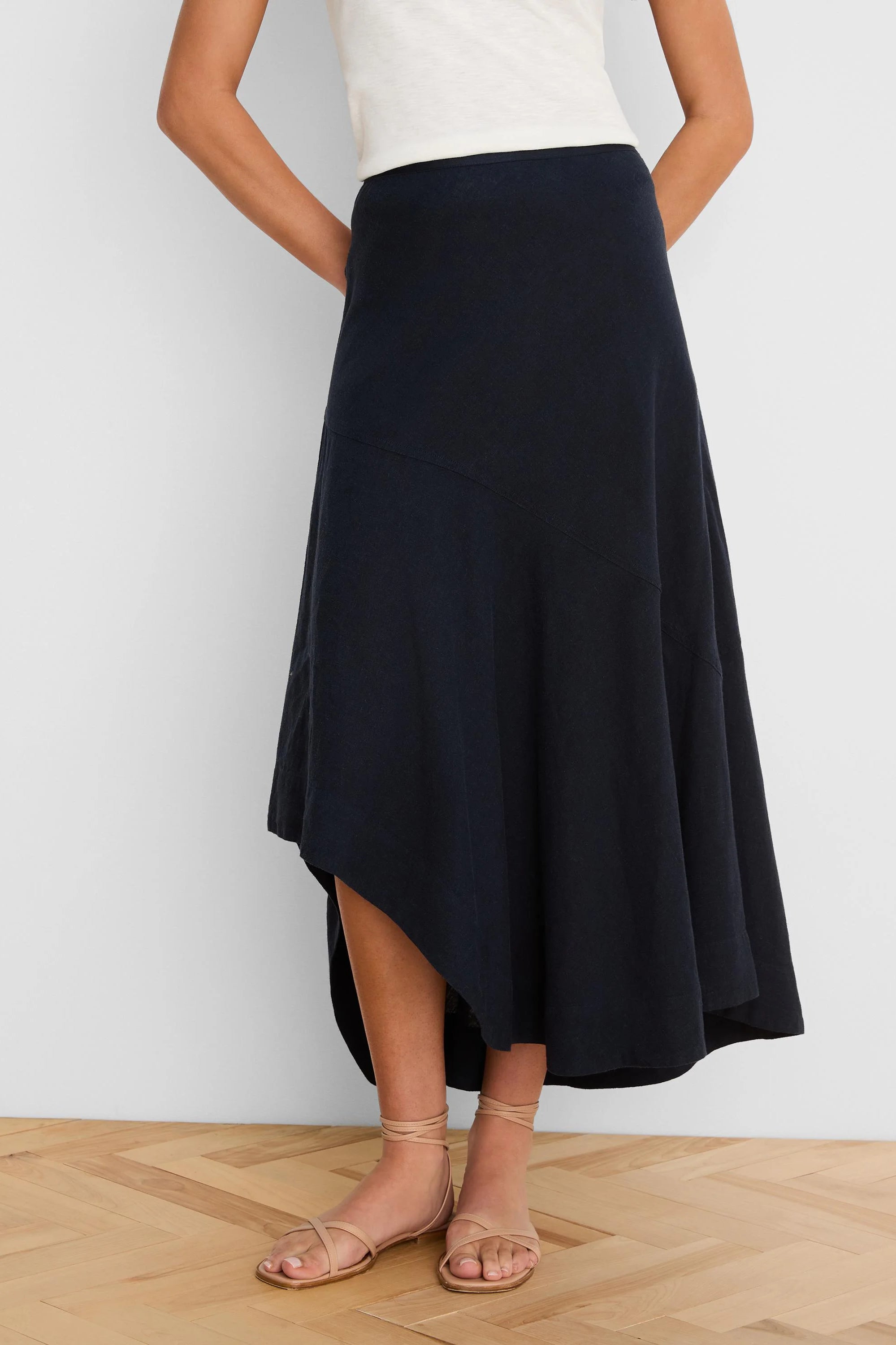 Navy blue linen skirt with a long, flowing asymmetrical "rumba" hem.