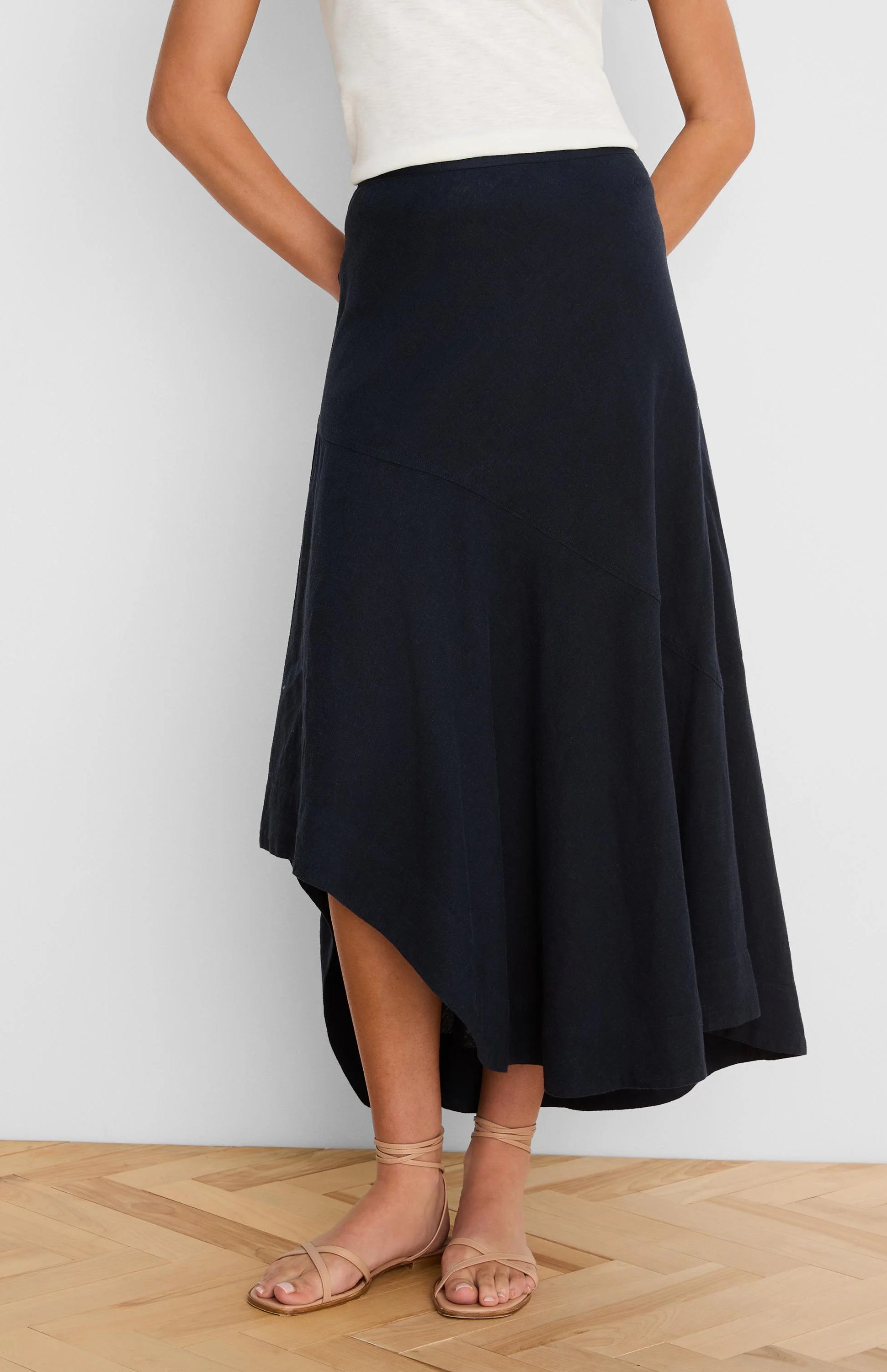 Navy blue linen skirt with a long, flowing asymmetrical "rumba" hem.