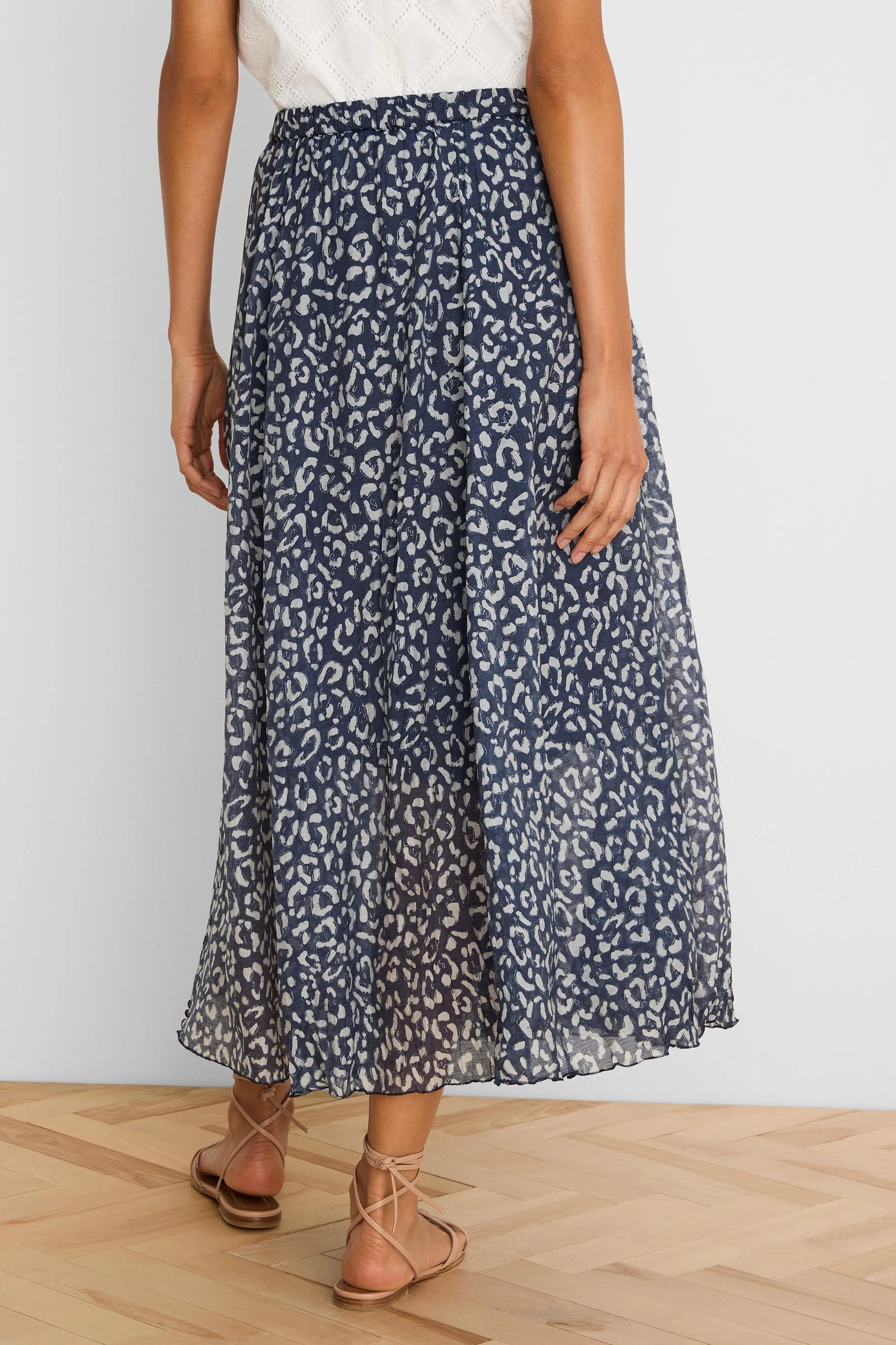 Navy crinkle midi skirt with off-white sketched leopard spots.