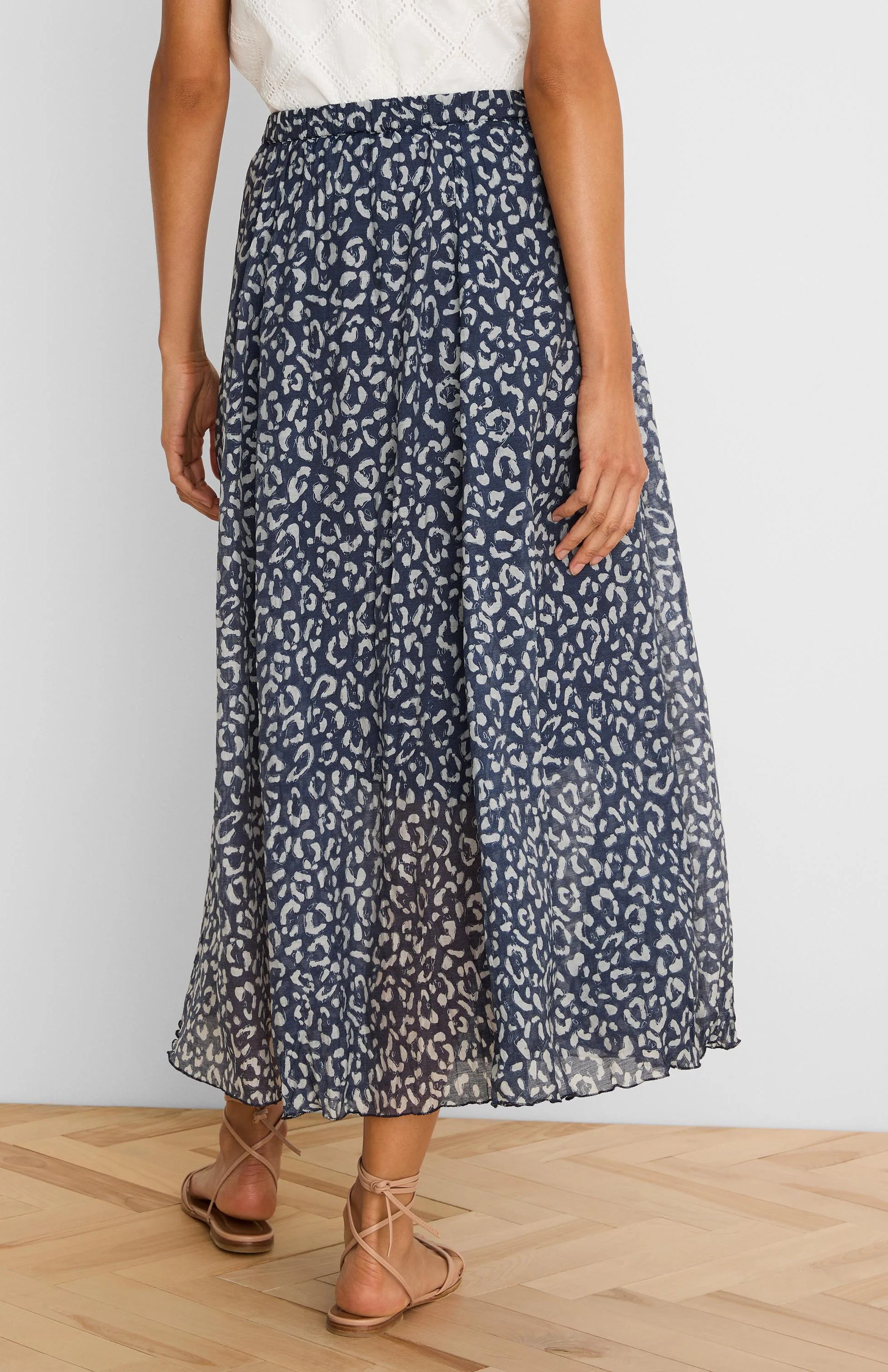 Navy crinkle midi skirt with off-white sketched leopard spots.