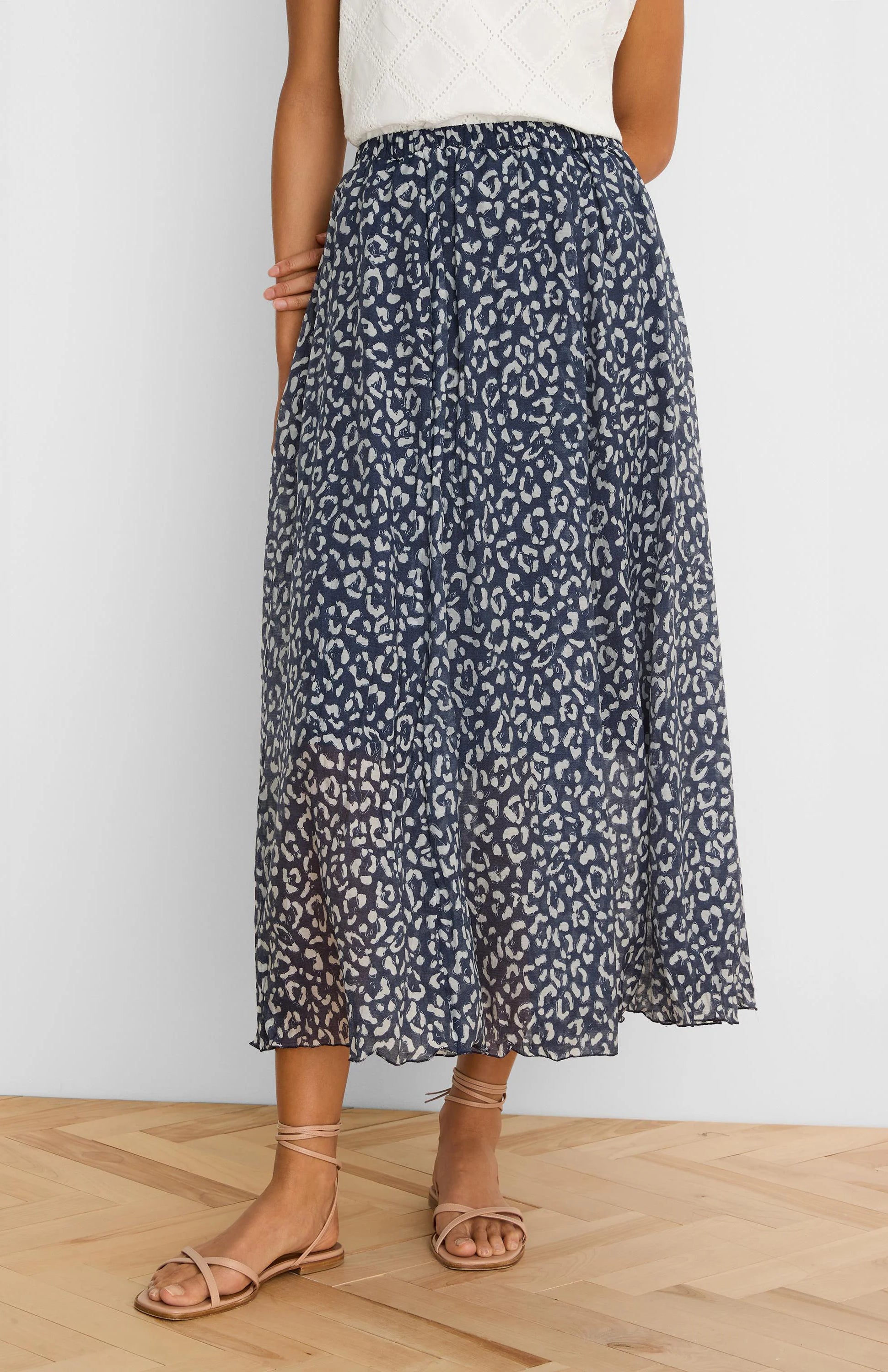 Navy crinkle midi skirt with light leopard sketch pattern, ankle-length.