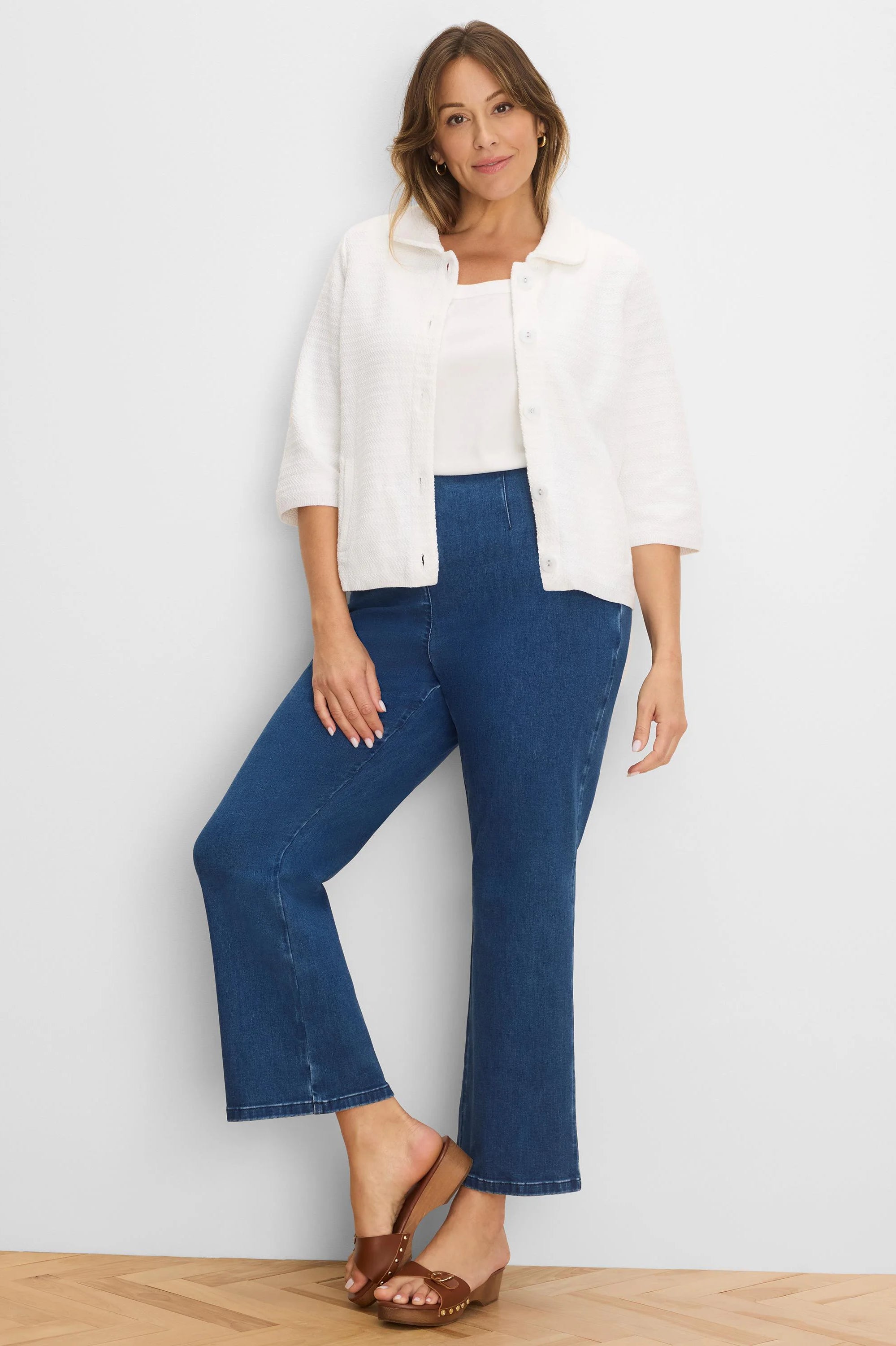 Dark blue, high-rise boot-cut jeans.