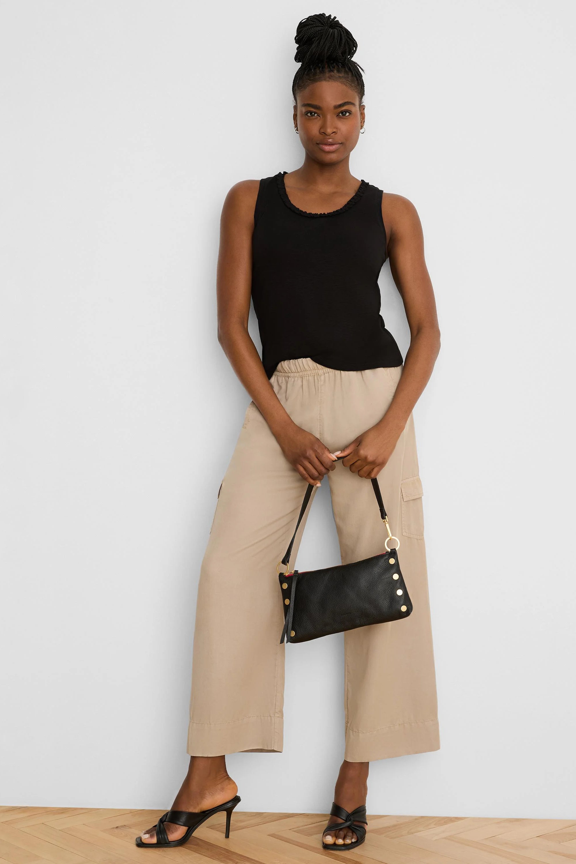 Light beige drapey wide leg cargo ankle pants with elastic waist and side pockets.