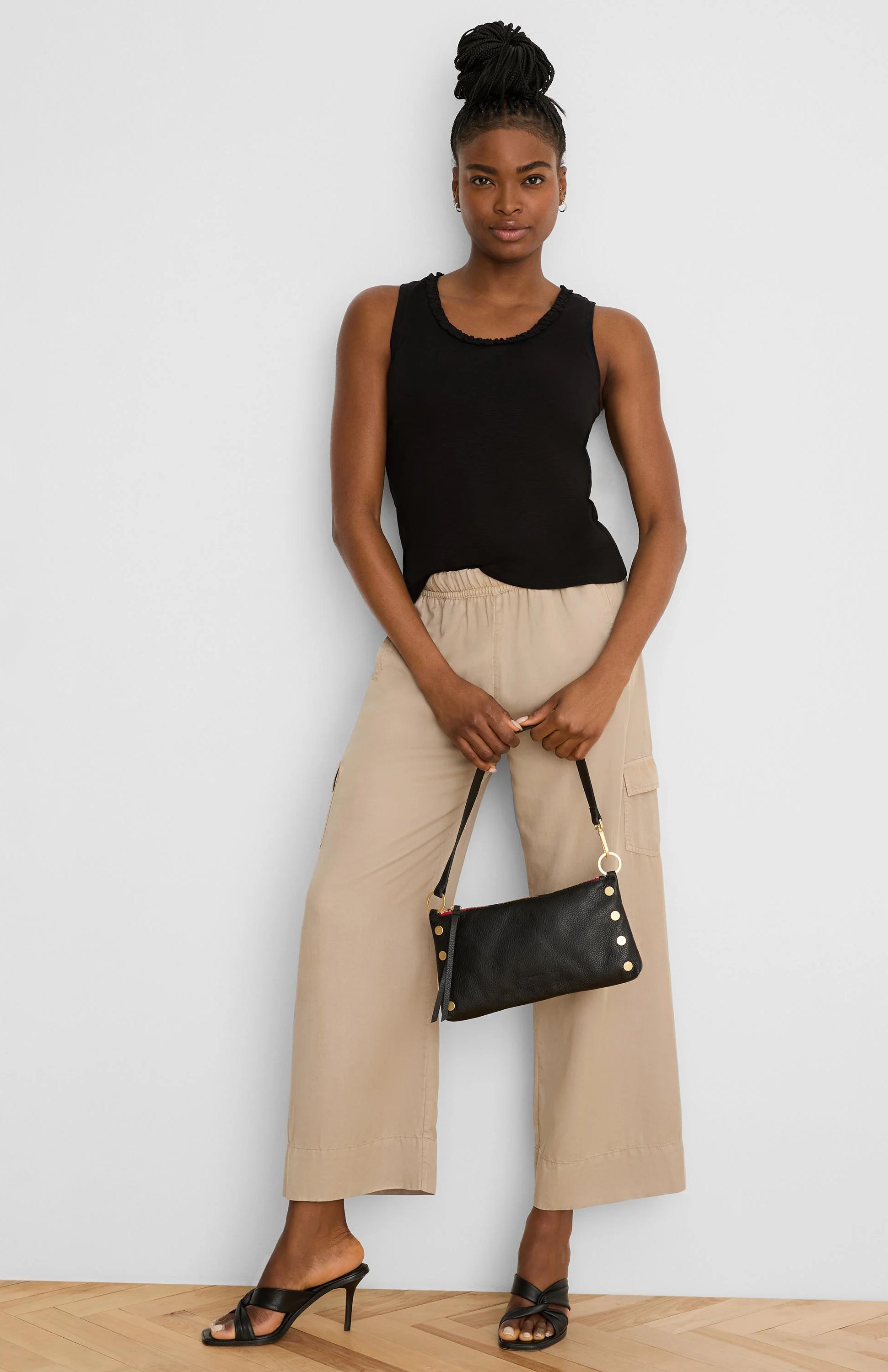 Light beige drapey wide leg cargo ankle pants with elastic waist and side pockets.