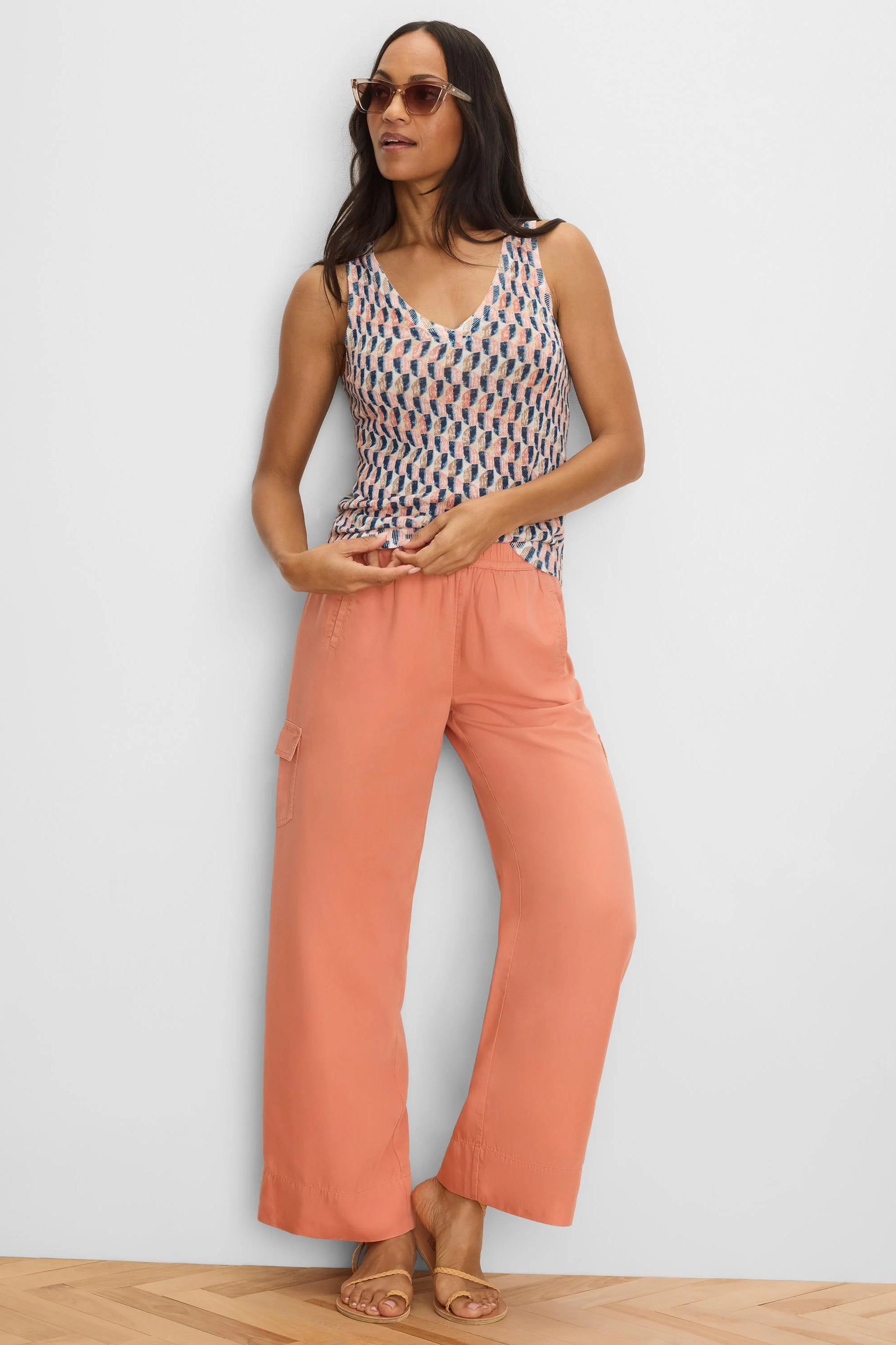 Peach wide-leg drapey cargo ankle pants with a flap pocket on the thigh.