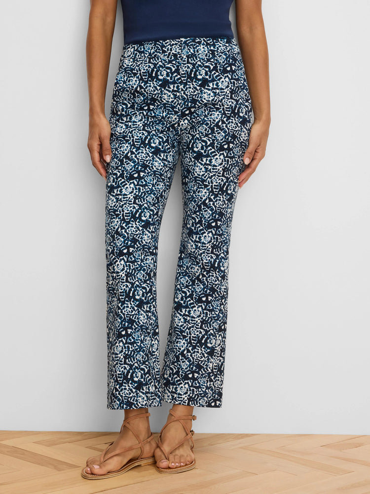 Dark blue and white shibori lily ankle pants with a demi-boot cut.