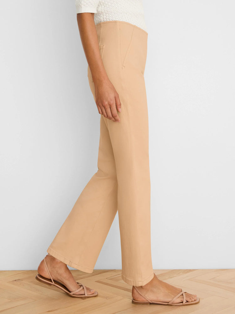 Light tan boot-cut jeans, high-waisted with a subtle flare, shown on a model from the side.