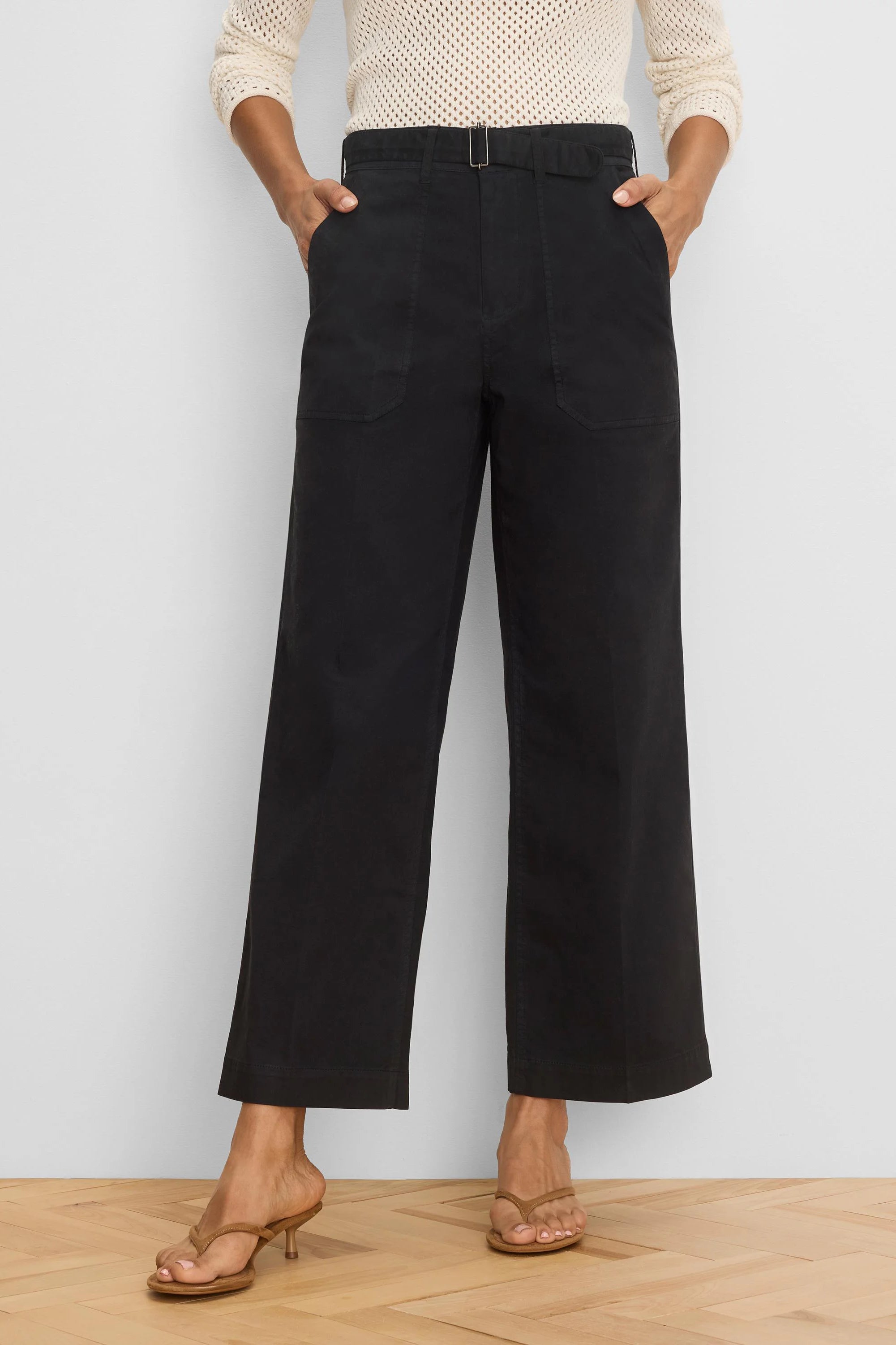 Black wide-leg ankle pants, featuring a silver buckle belt, and front & back patch pockets.