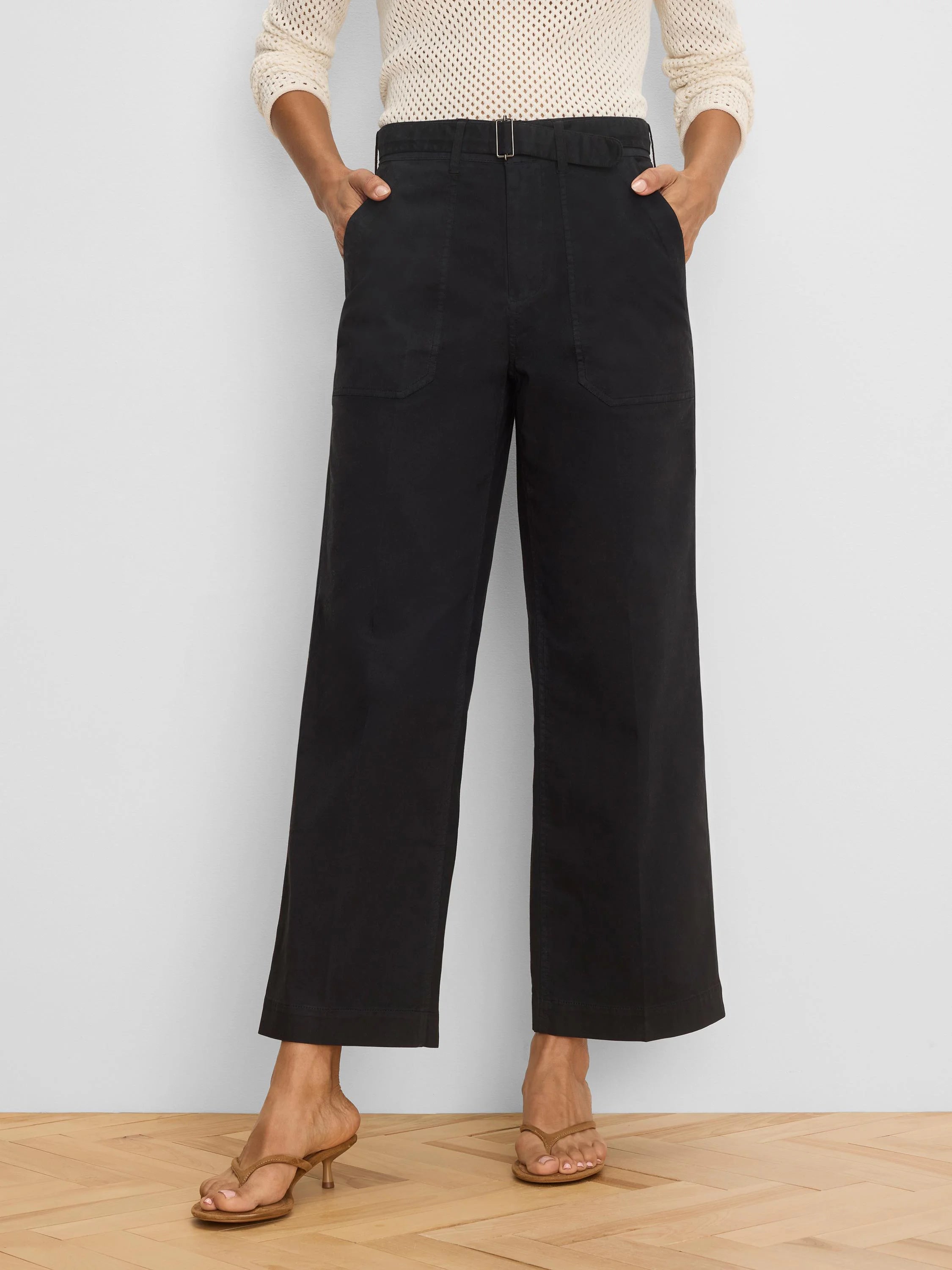 Black wide-leg ankle pants, featuring a silver buckle belt, and front & back patch pockets.