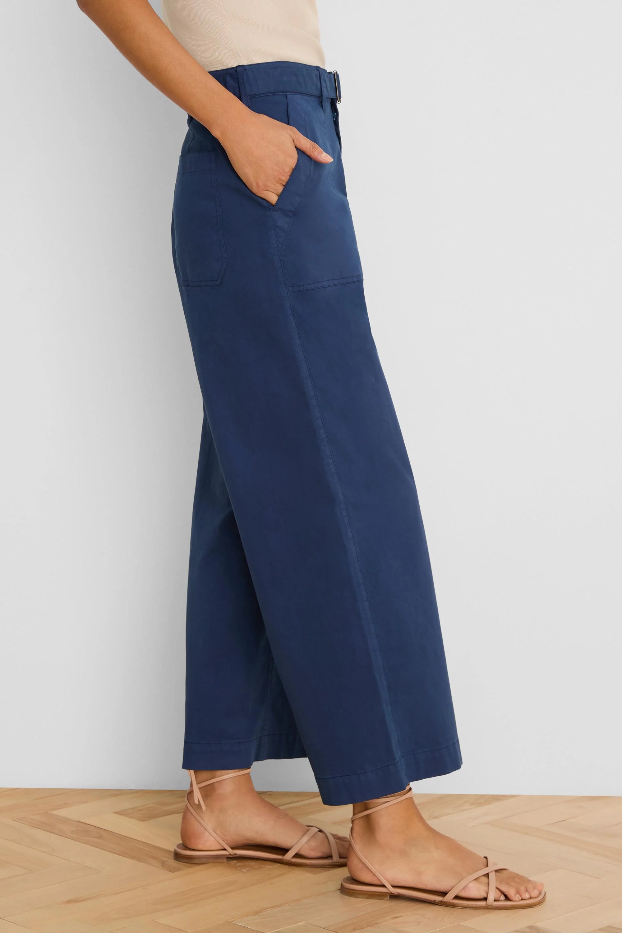 Navy wide-leg belted ankle pants with side pockets.