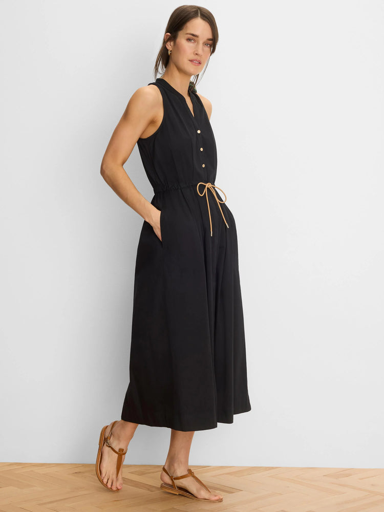 Black sleeveless V-neck midi dress with gold buttons, drawstring waist with tan tie, and side pockets.