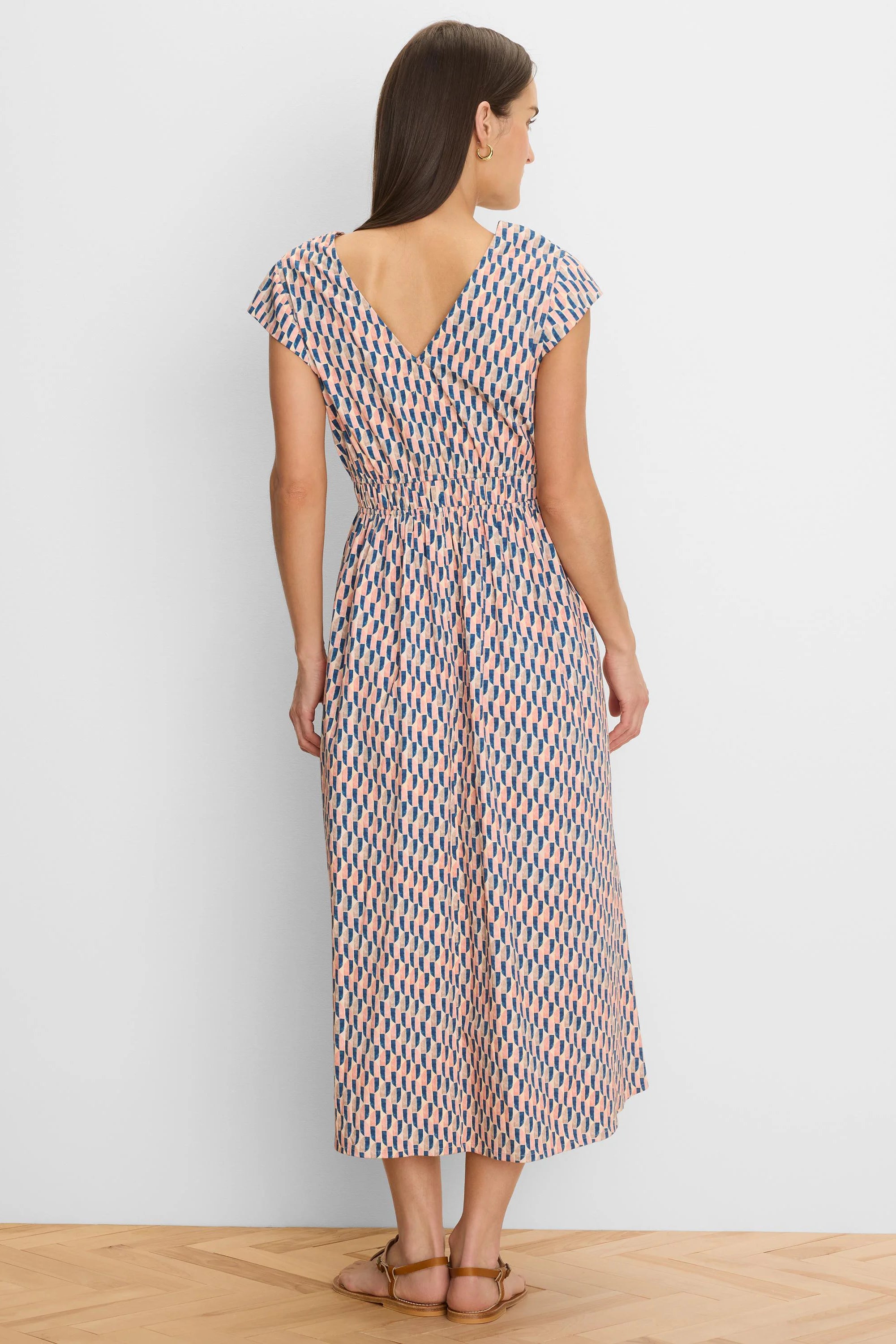 Cap sleeve midi dress with pink, blue, beige geometric pattern, V-back, and elasticated waist.