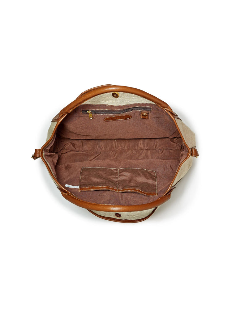Open beige linen tote with brown leather handles and trim. Dark brown interior with zipper pocket, two slip pockets, and...
