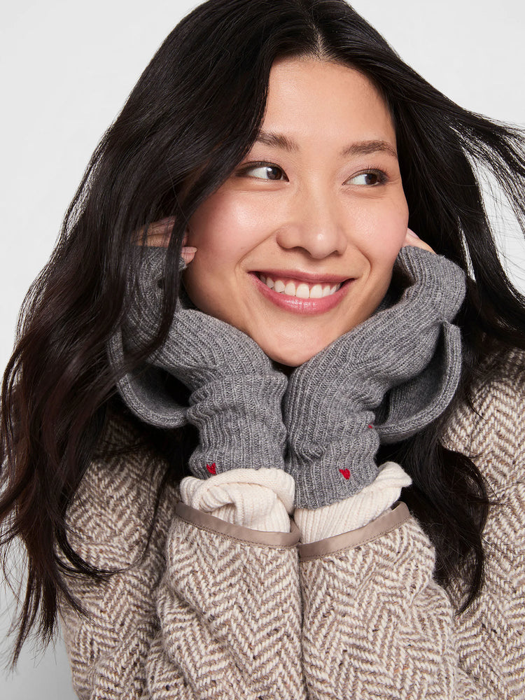 Grey ribbed mittens feature a small red heart embroidery on each hand.