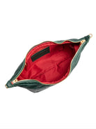 Dark green leather shoulder bag, gold zipper, red interior.