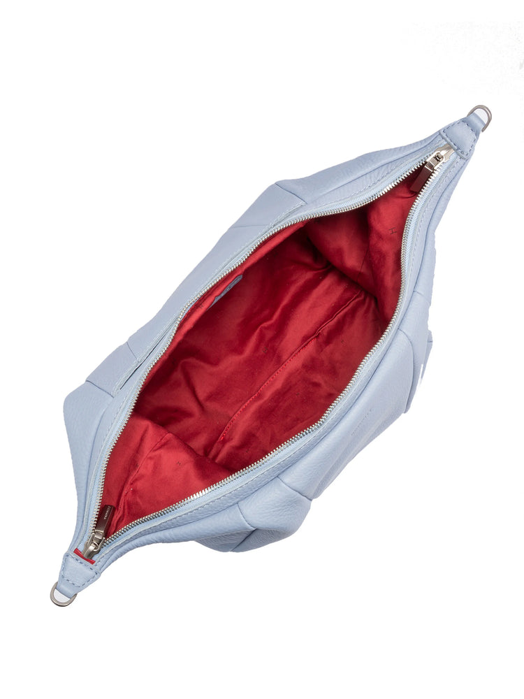 Light blue leather shoulder bag with silver zipper & red interior lining. Open, showing interior.