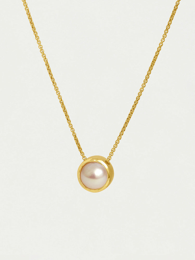 Gold chain necklace with a round, off-white pearl pendant.