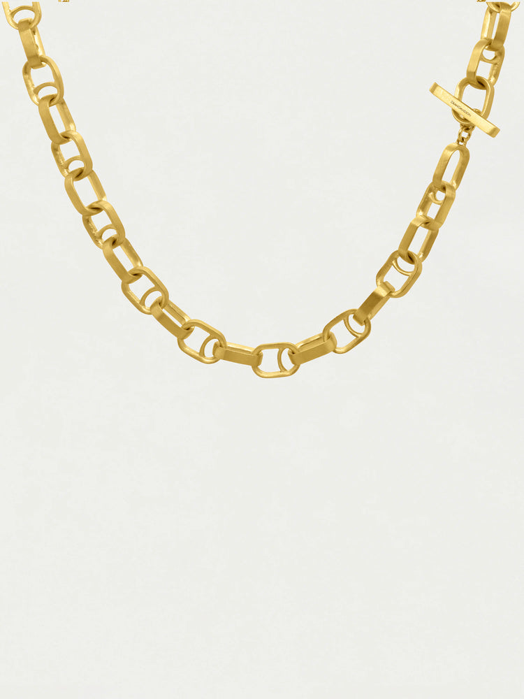 Gold, matte finish necklace. Interlocking rectangular links, bar clasp with logo.