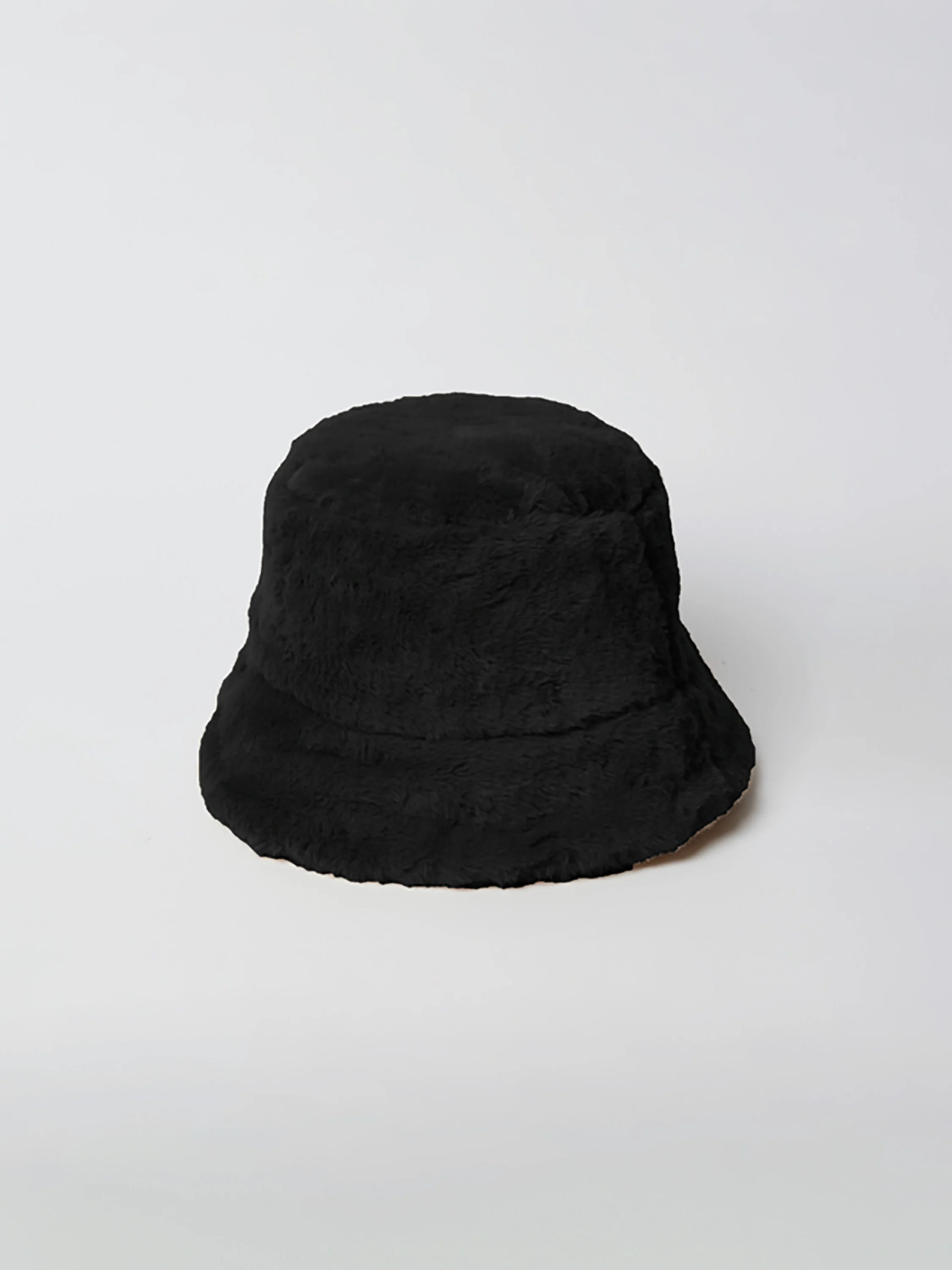 Black faux fur bucket hat.  Shows a slight hint of a light tan/beige underside of the brim.