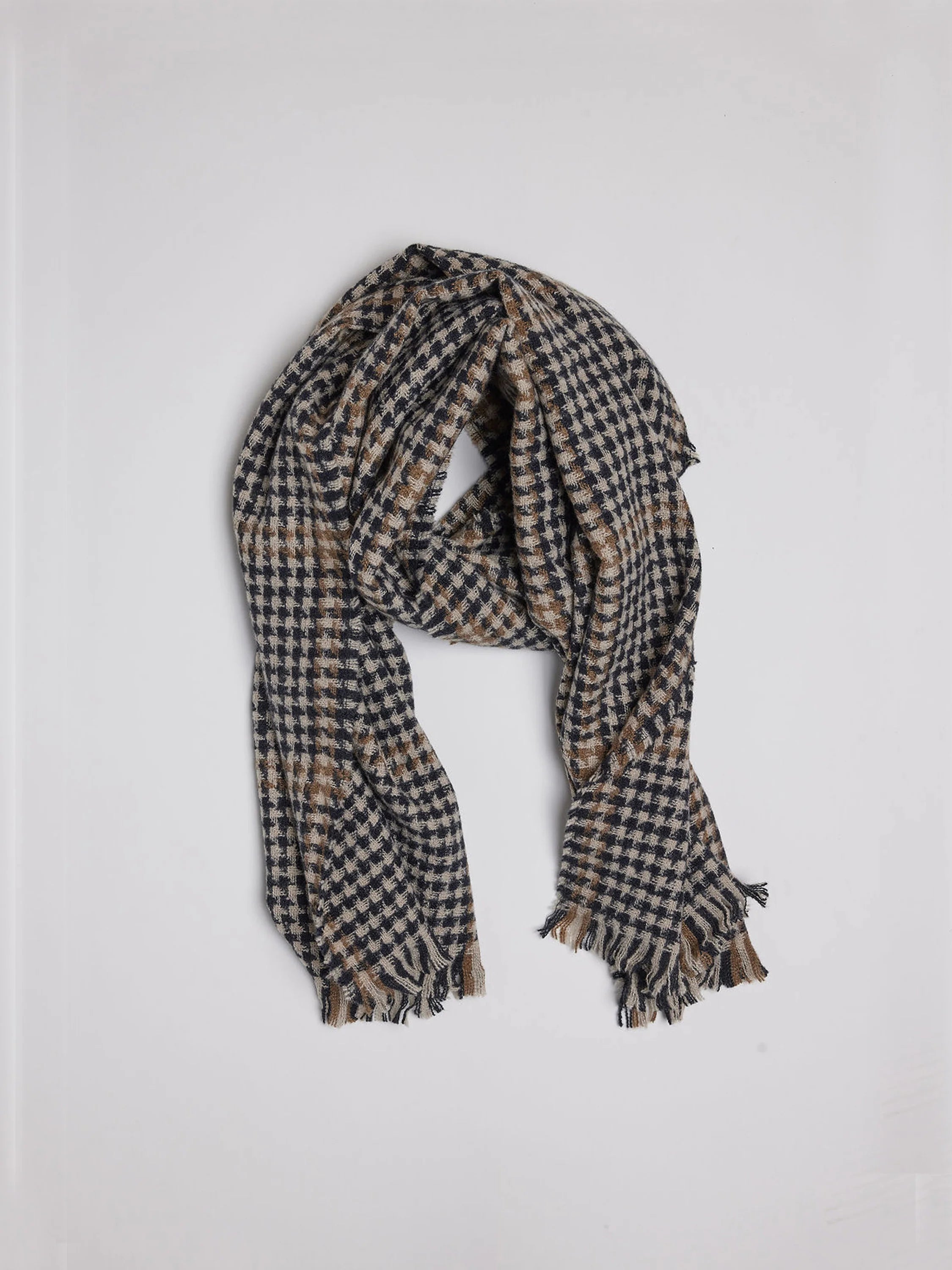 Black, tan & brown houndstooth scarf with fringed ends.