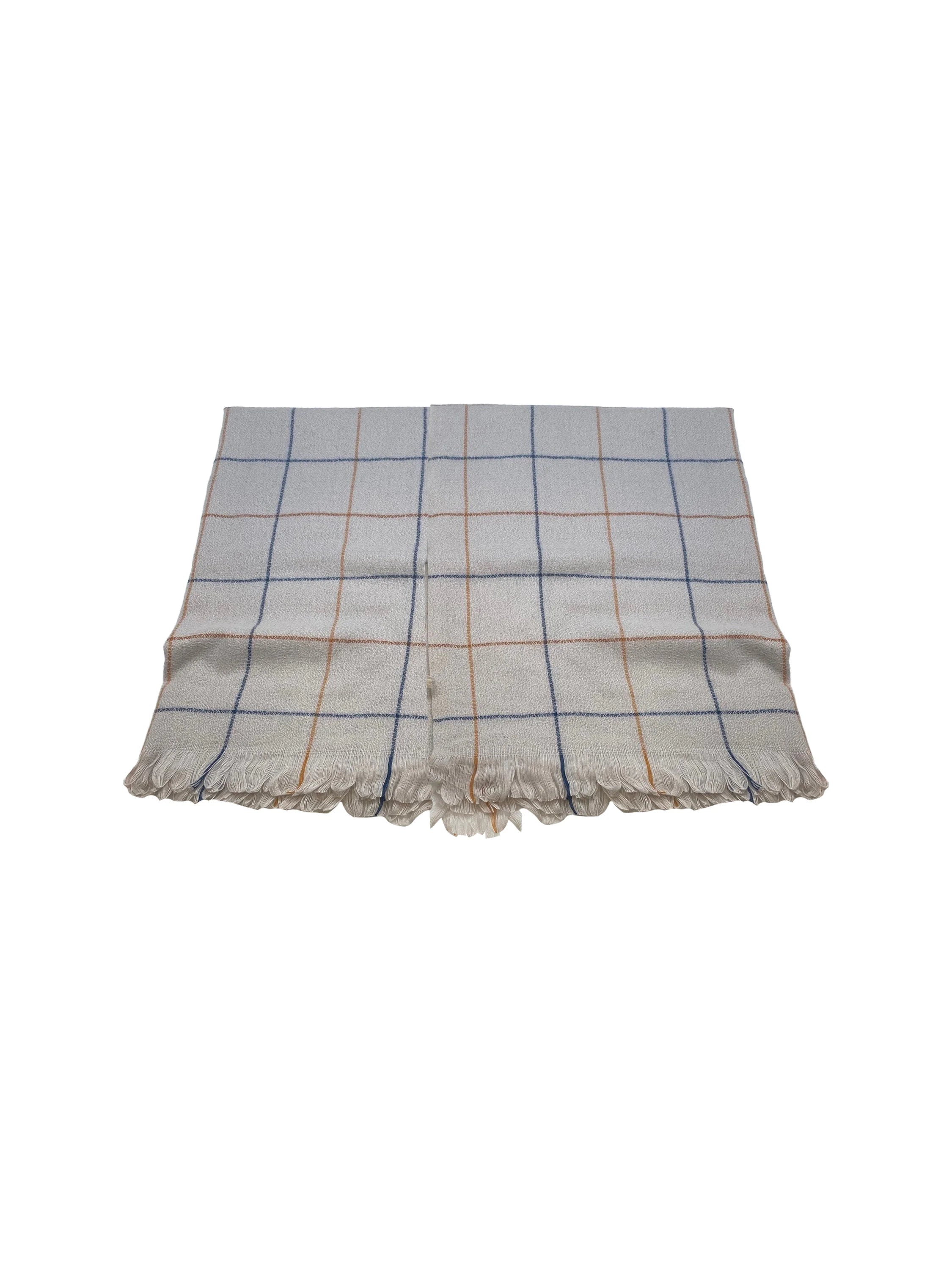 Off-white scarf with blue and orange windowpane pattern and fringed edges.