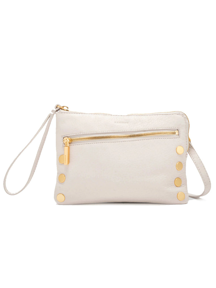 Greige pebbled leather clutch with gold zippers, a front pocket, a wristlet strap, and four gold studs.