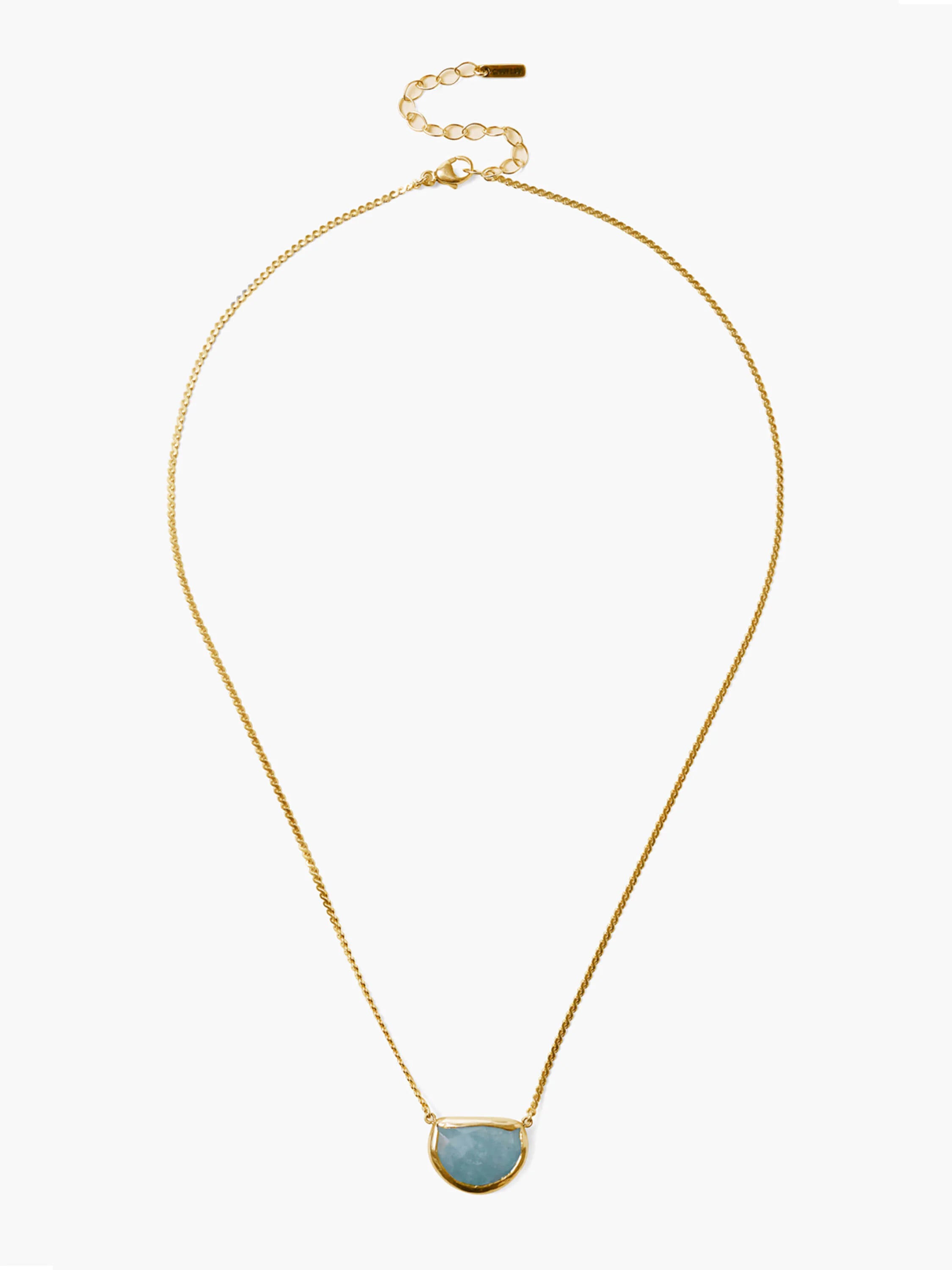 Gold-tone chain necklace with a light blue, semi-circular moonstone pendant in a gold bezel. Features an extender chain.