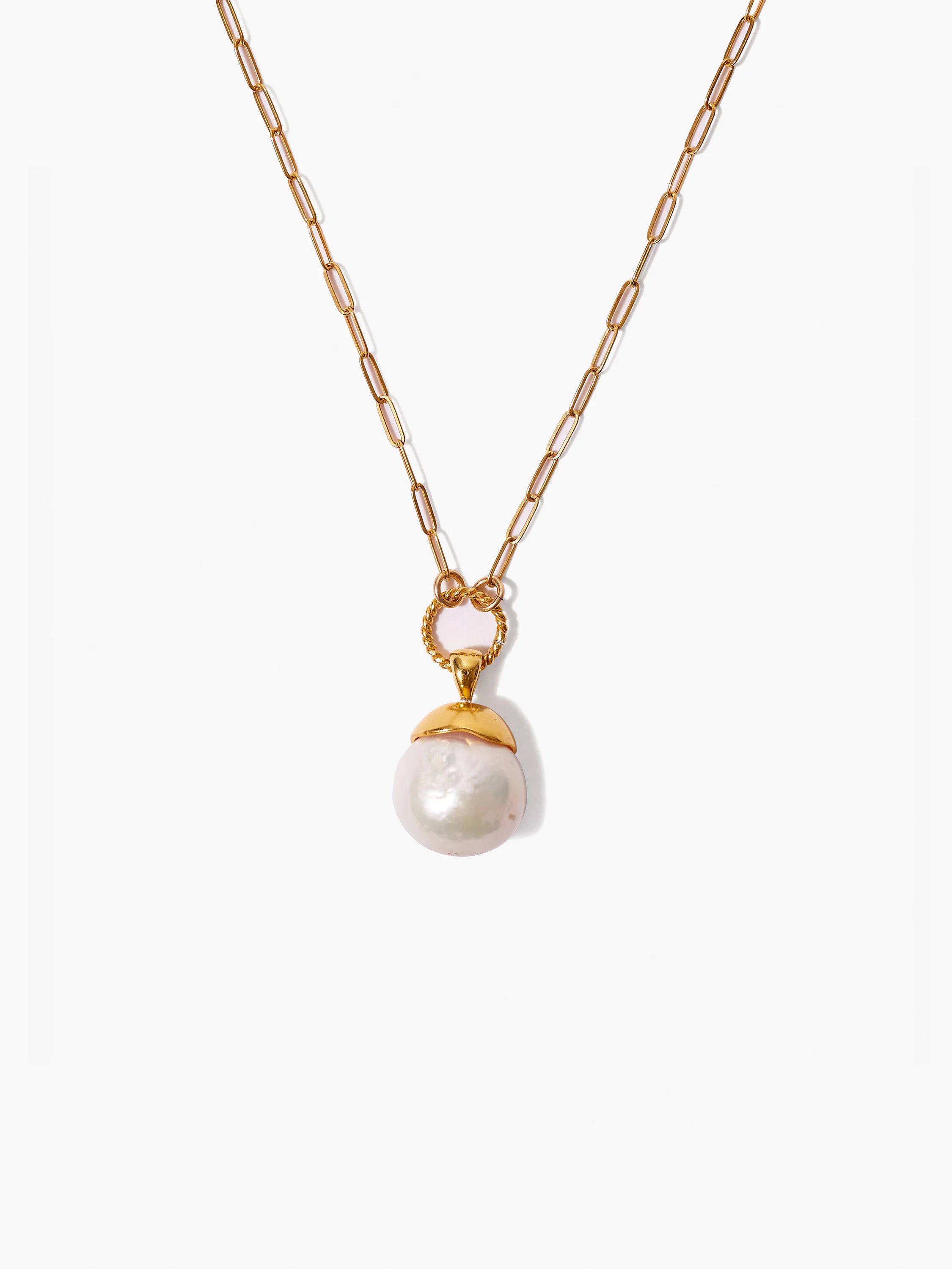 Gold chain necklace with large off-white pearl pendant; twisted gold detail at clasp.