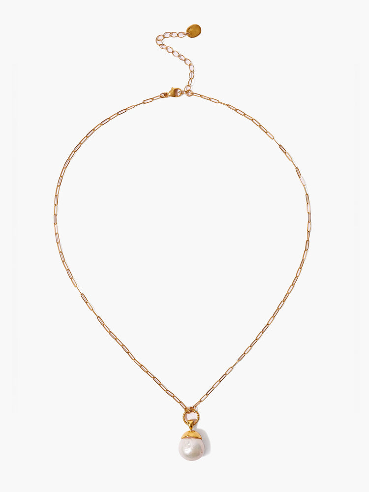 Gold chain necklace with a large off-white pearl pendant.
