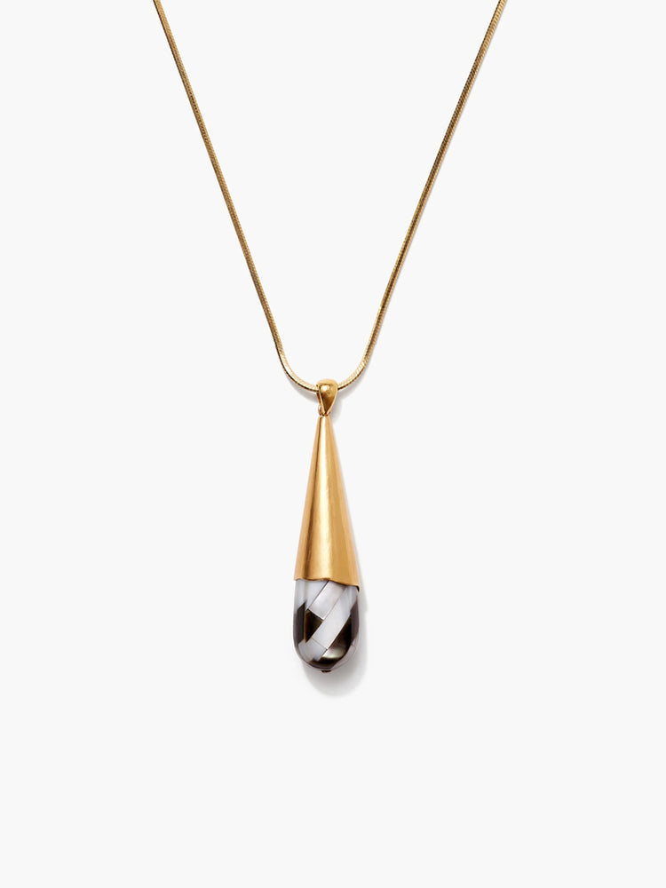 Gold snake chain necklace with a pendant: gold conical top, black & white striped mother-of-pearl teardrop.