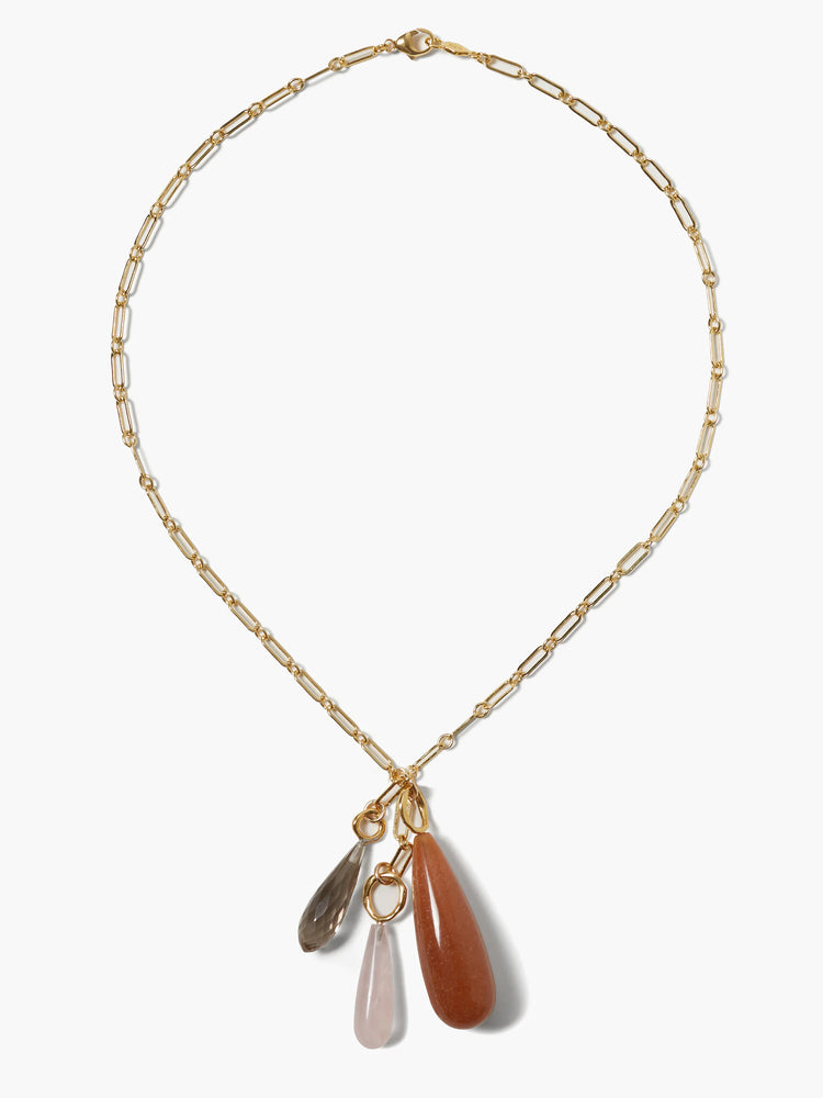 Gold elongated link necklace with three tear-drop stone pendants: dark grey, light pink, and burnt orange.