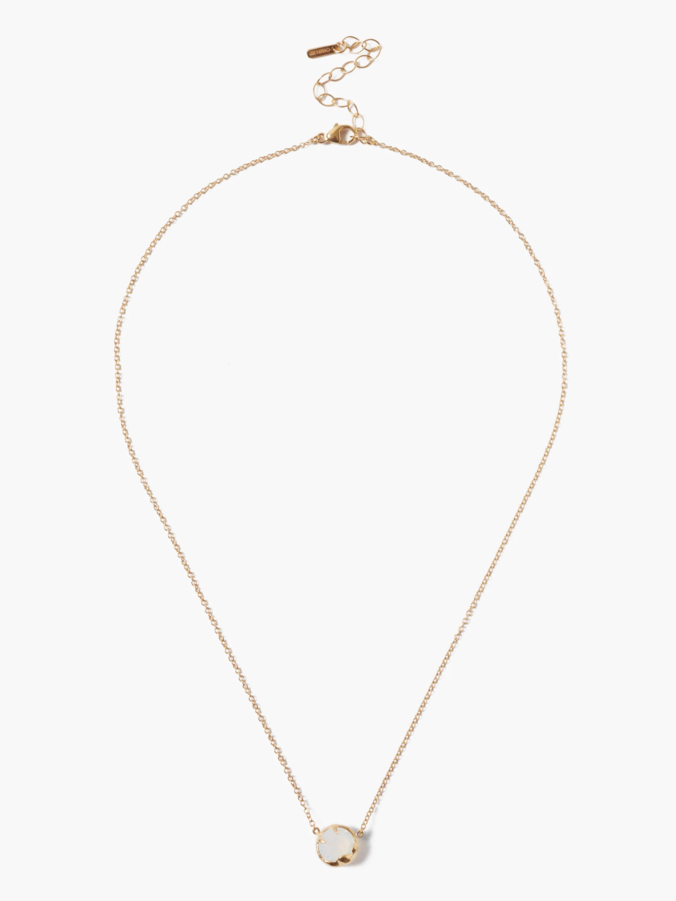 Thin gold-tone chain necklace with a round, milky white iridescent stone pendant in a gold-tone bezel. Adjustable clasp.
