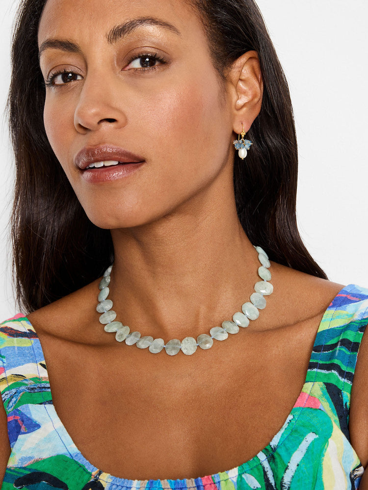 Choker necklace with pale green, flattened, faceted gem stones.