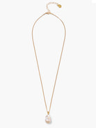 Gold chain necklace with a single, irregular iridescent white baroque pearl pendant.